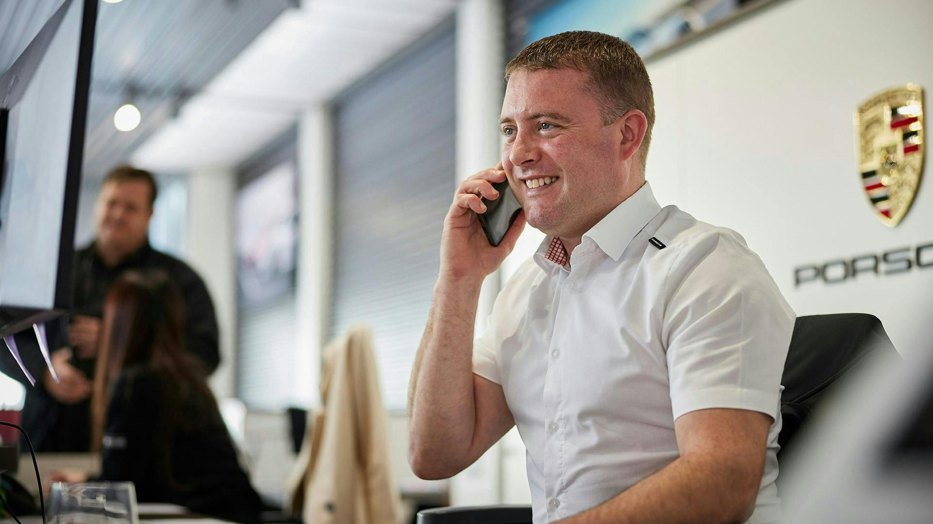 Porsche staff speaking on the phone