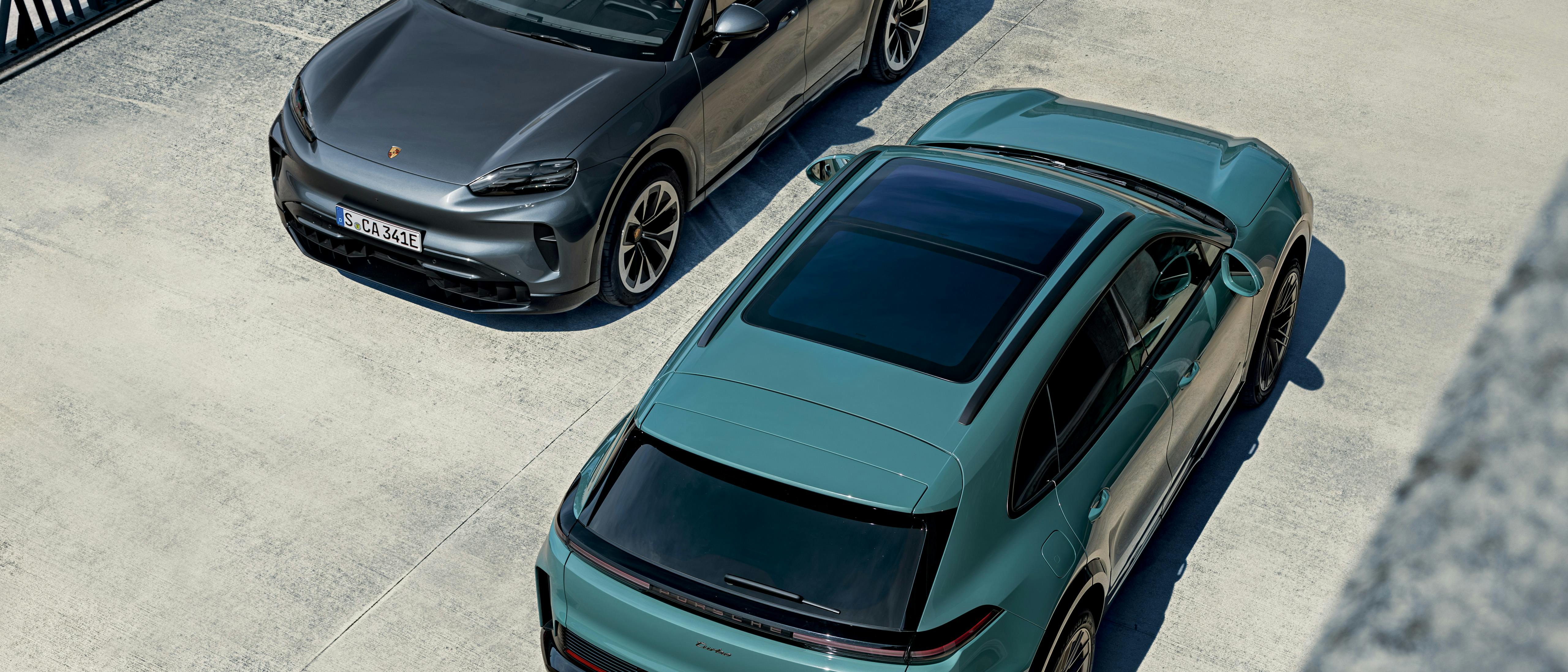 An aerial view of the Cayenne Electric and Cayenne Turbo Electric parked side by side.