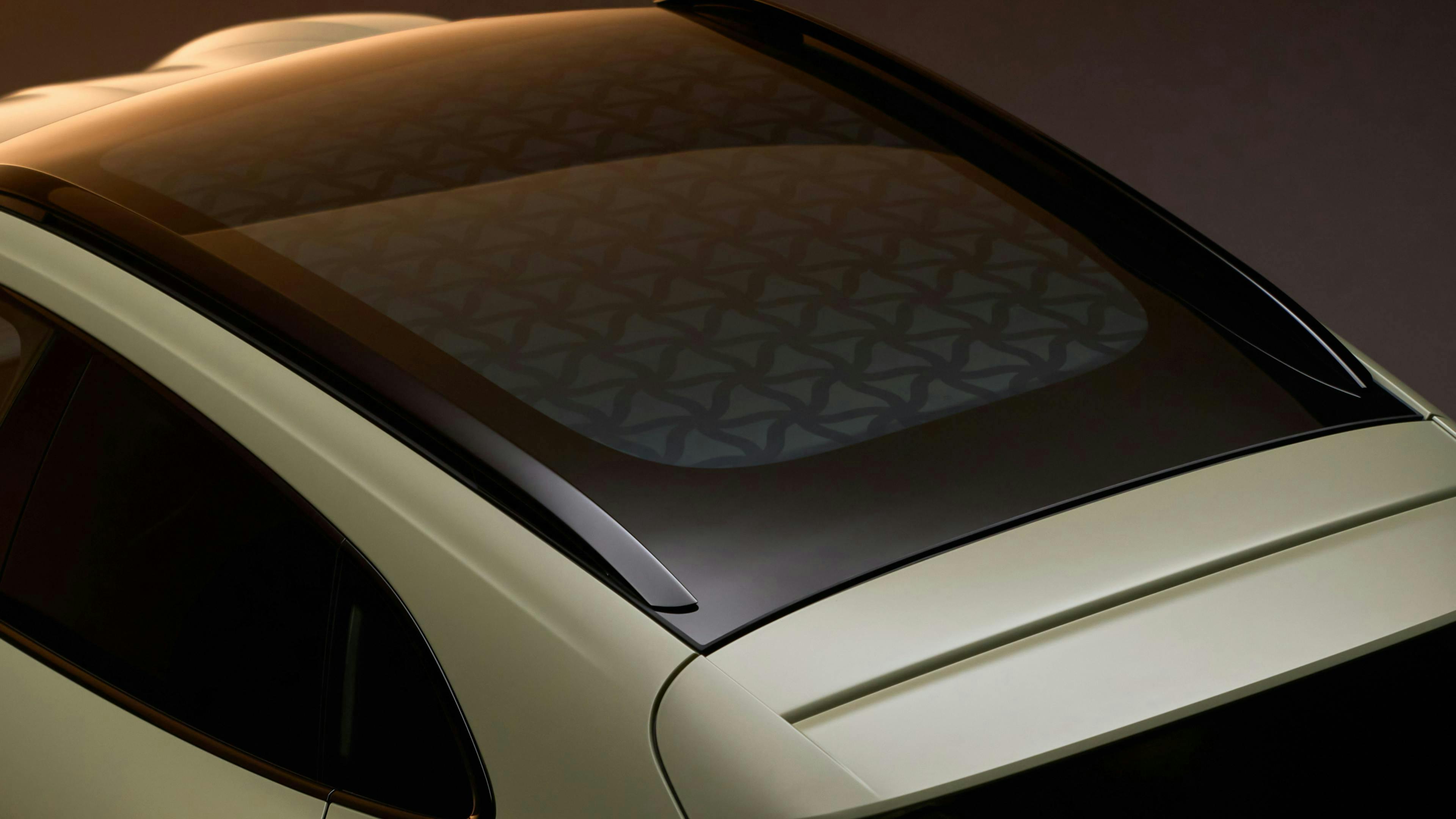 Rear roof of the Taycan Turbo S Soho House One showing the Variable Light Control glass panel and its laser etched geometric pattern.