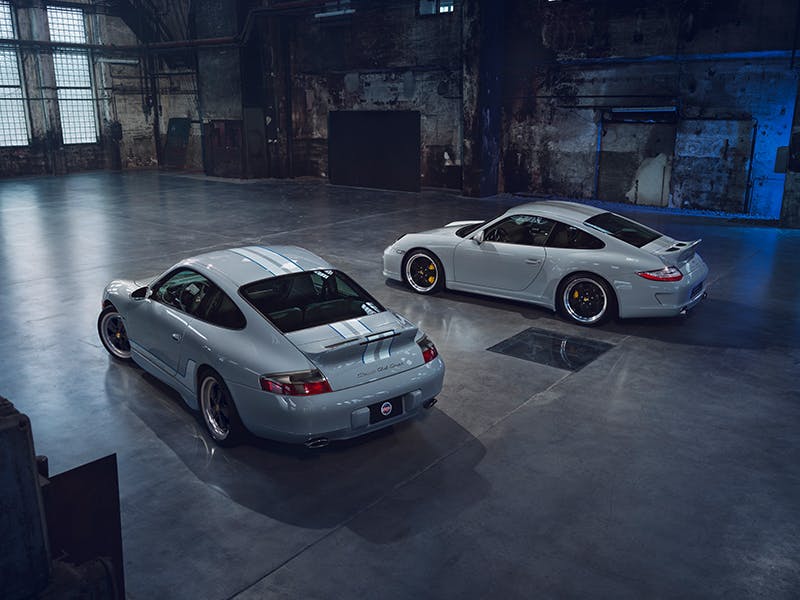 911 Classic Club Coupe and 911 Sport Classic (Type 997) in the factory building, rear views.