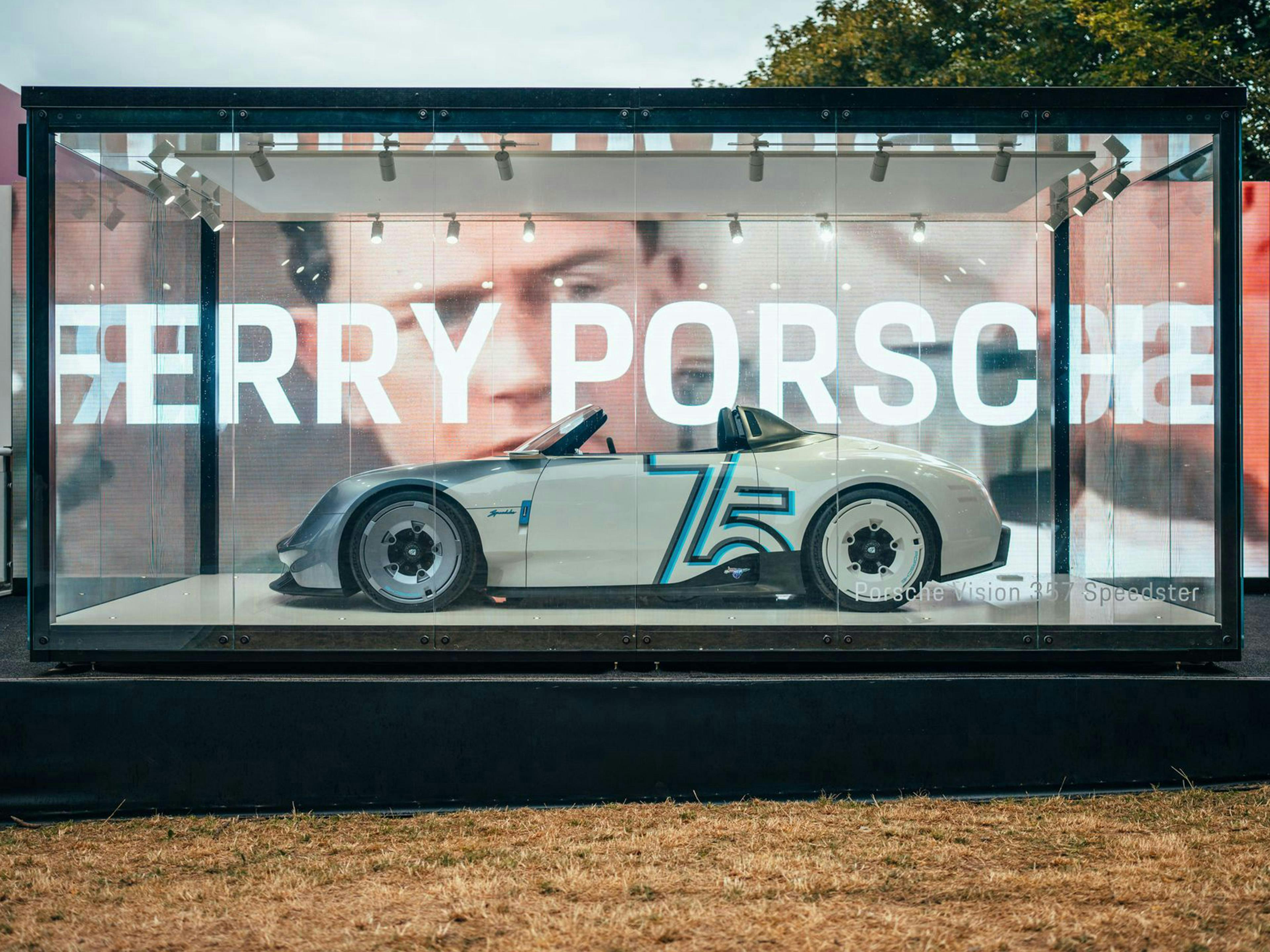 Vision 357 Speedster on display in a large glass case, proudly making its global debut at the Porsche Experience Centre.