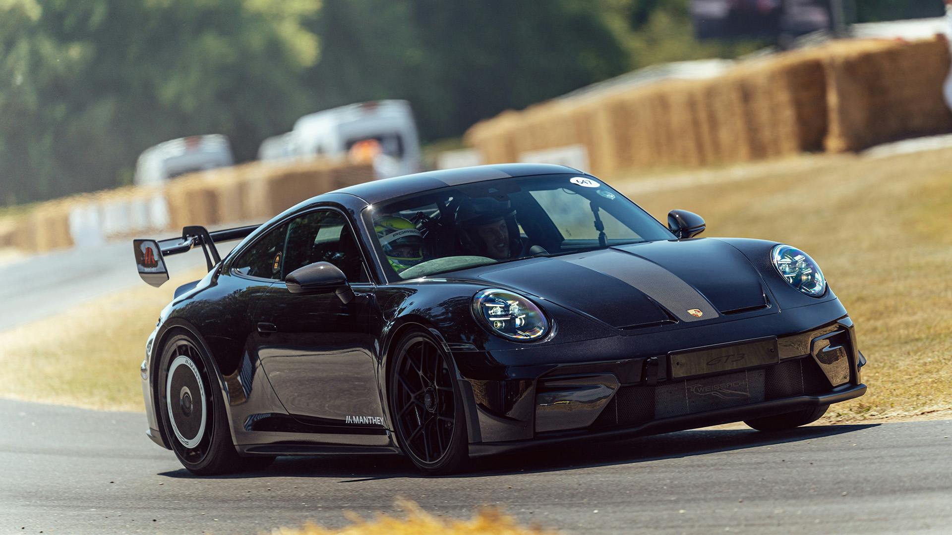 Porsche 911 GT3 driving the Goodwood hillclimb.