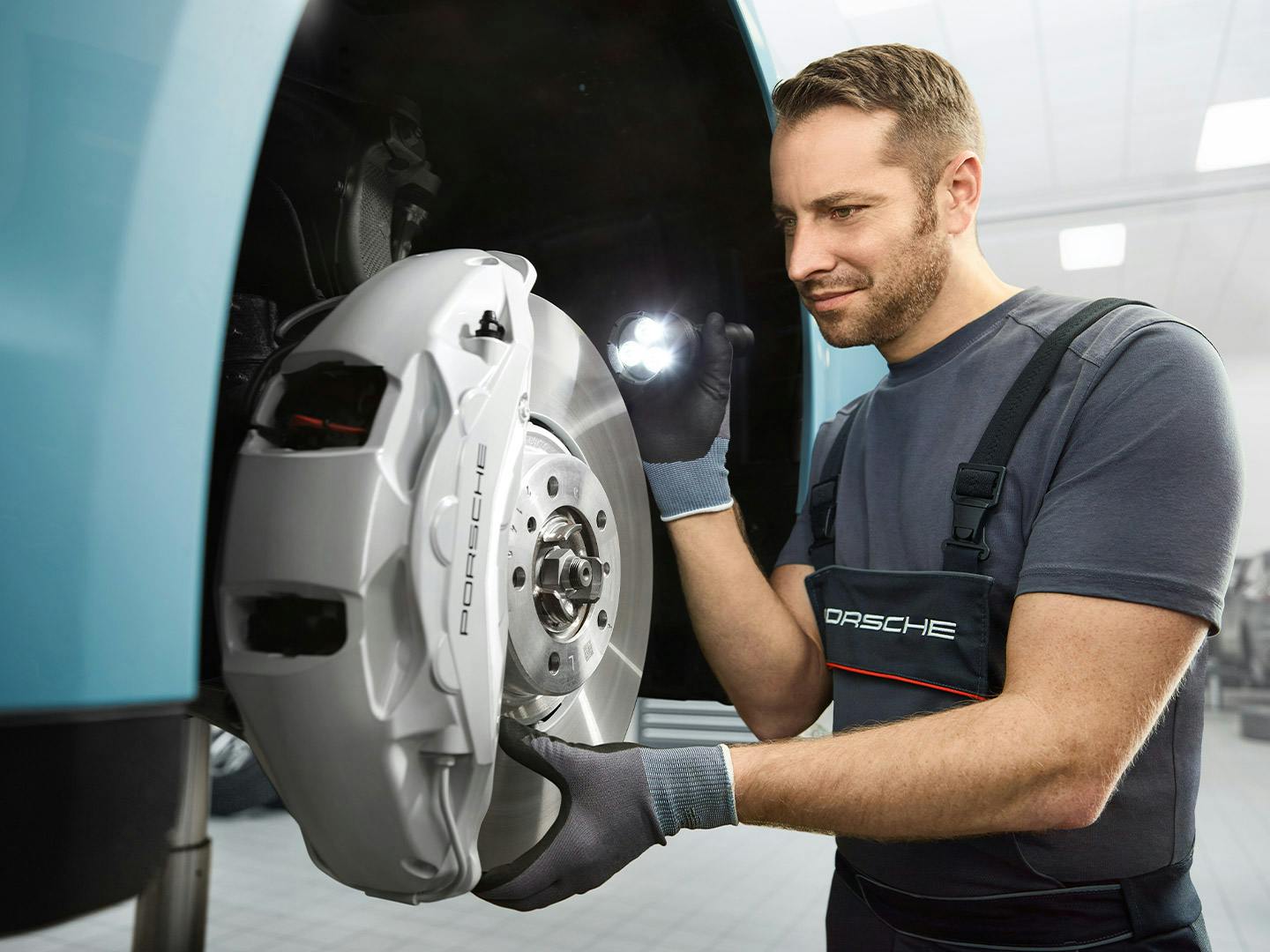 Service Technician checking brake pads
