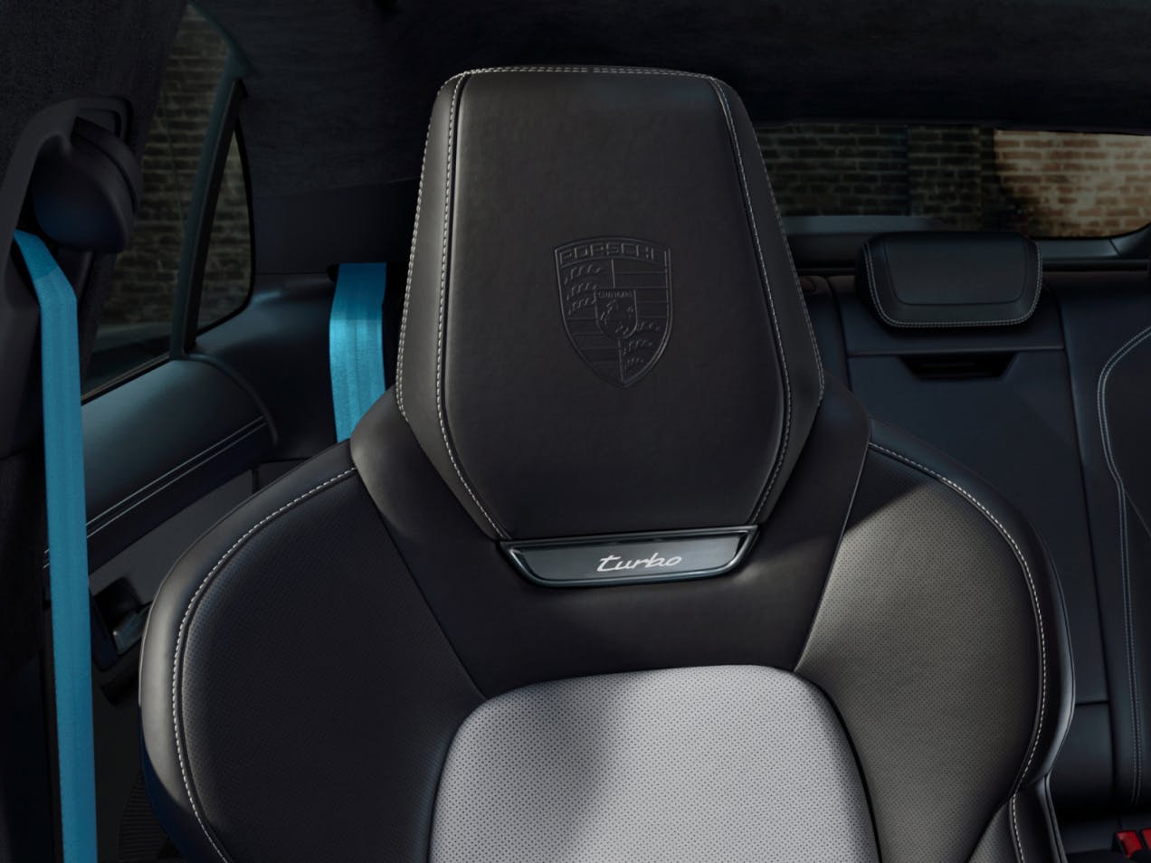 Detailed view of the headrests with embossed Porsche crest in the Porsche Exclusive Manufaktur Macan Turbo.