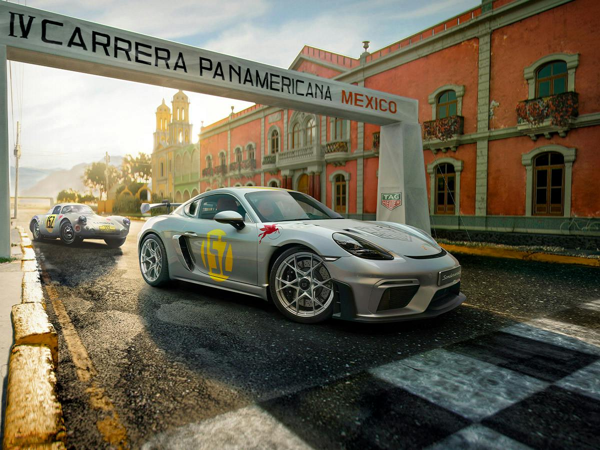 A silver 718 GT4 RS Carrera Panamericana Special standing under a gate with the lettering Carrera Panamerica Mexico and an older model in the same painting behind it in a Mexican town.