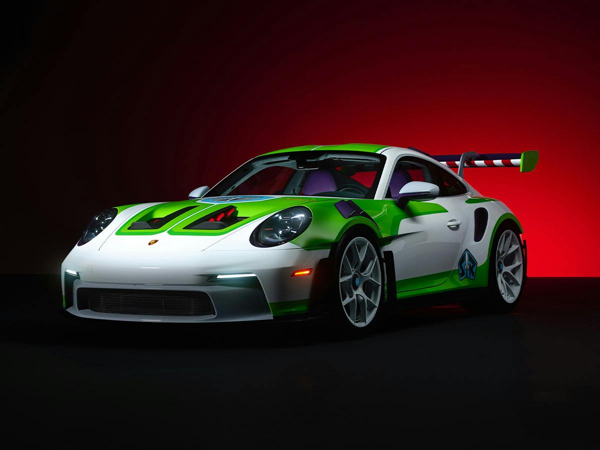 Porsche 911 GT3 RS “Buzz Lightyear”, front three-quarter view in White with accents in Lizard Green, Green Yellow, Light Sport Grey and Royal Purple.​