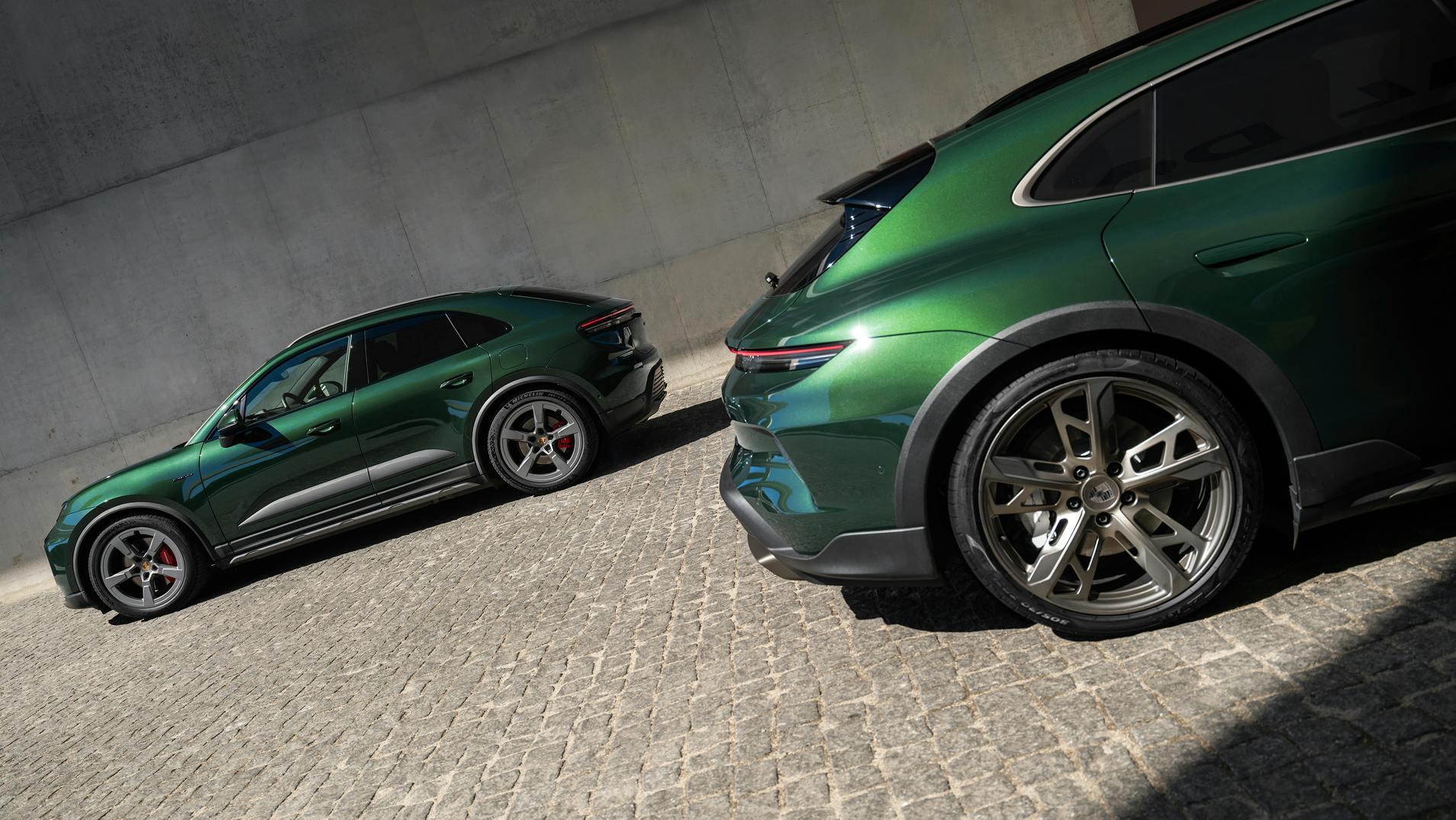 View of the side of a Macan 4S and the rear of a Taycan Turbo Cross Turismo parked next to each other.