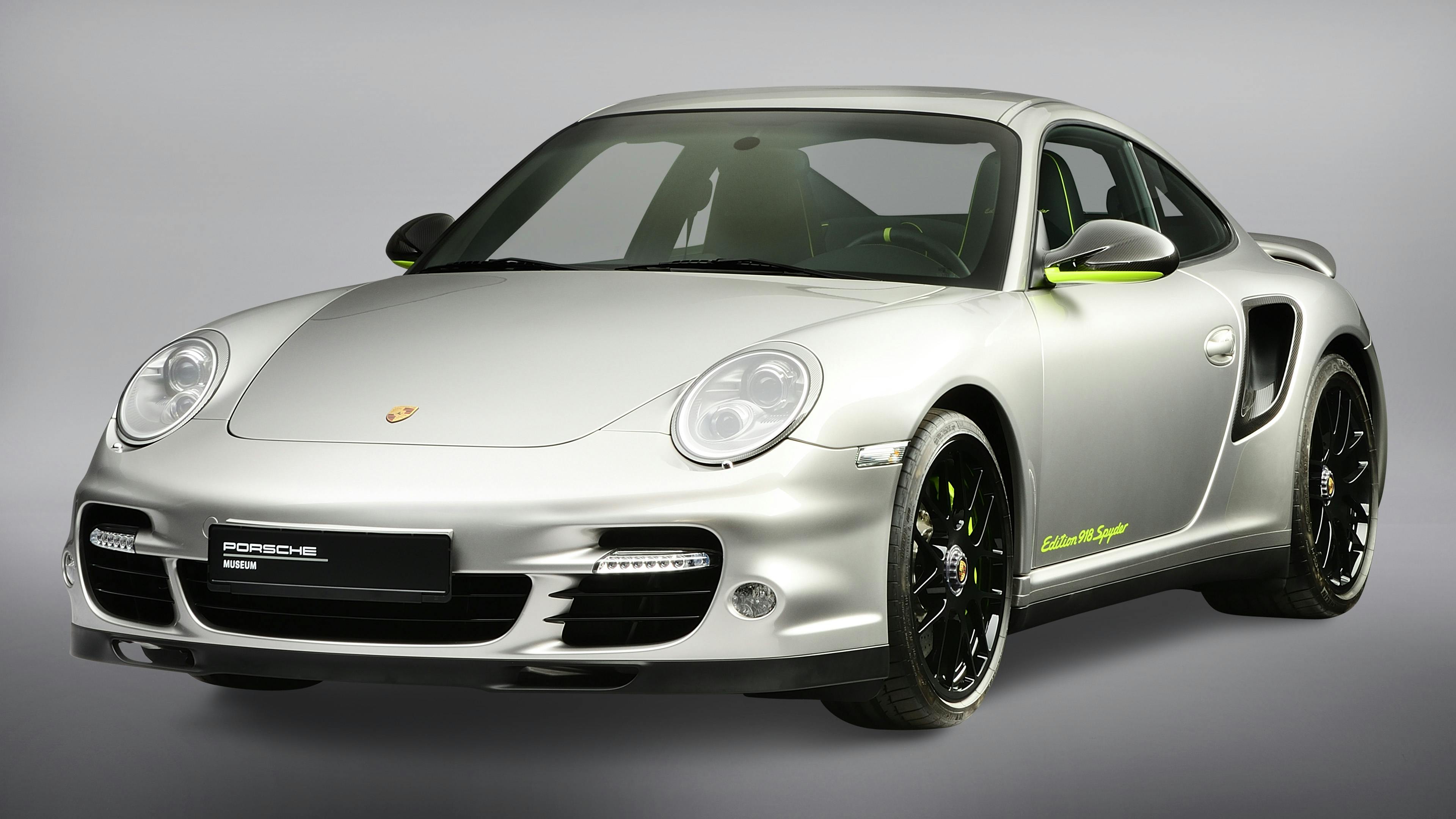 Studio shot of the 911 Turbo S Edition 918 Spyder on a light background.