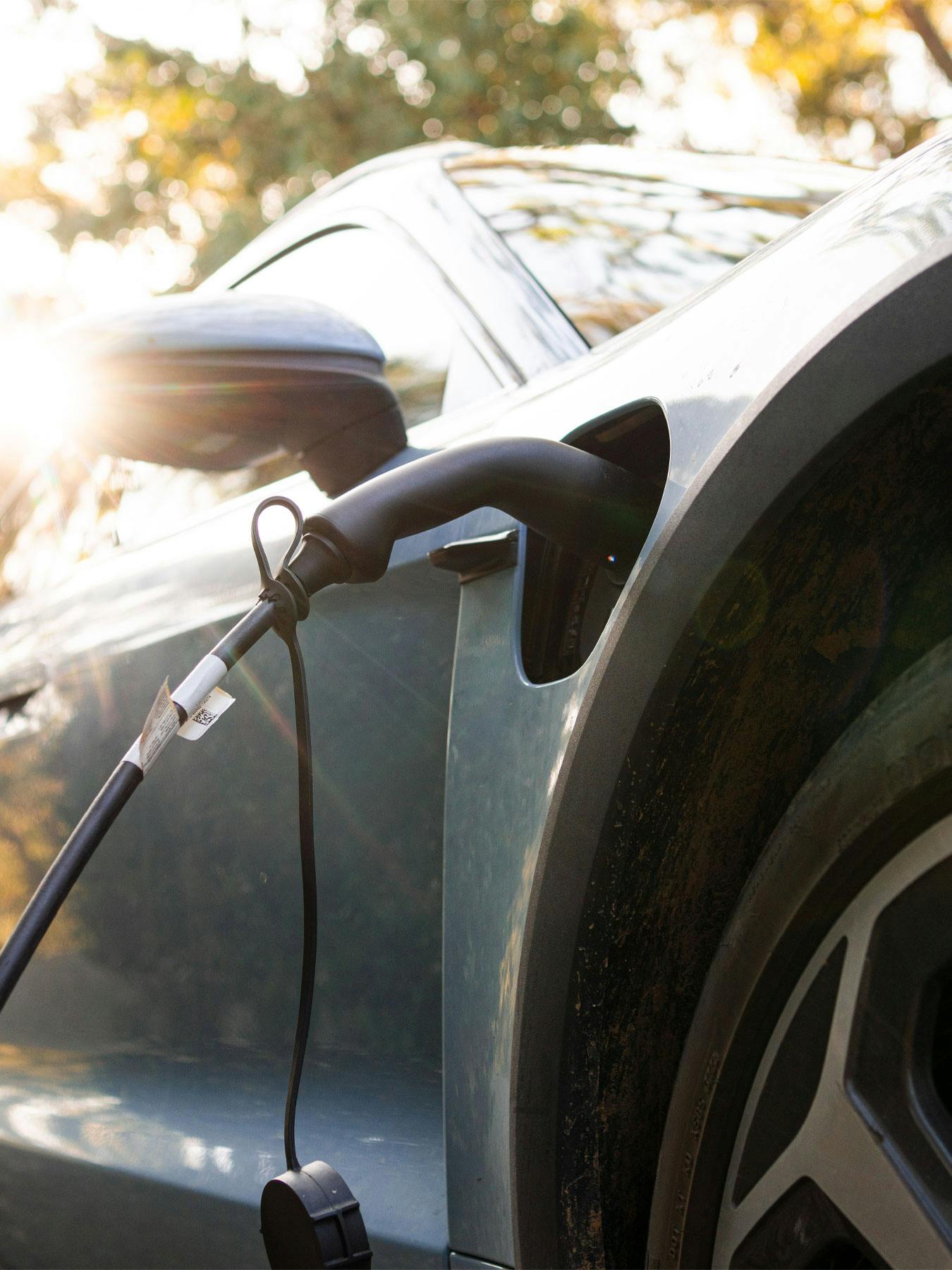 Porsche Taycan with charger plugged in