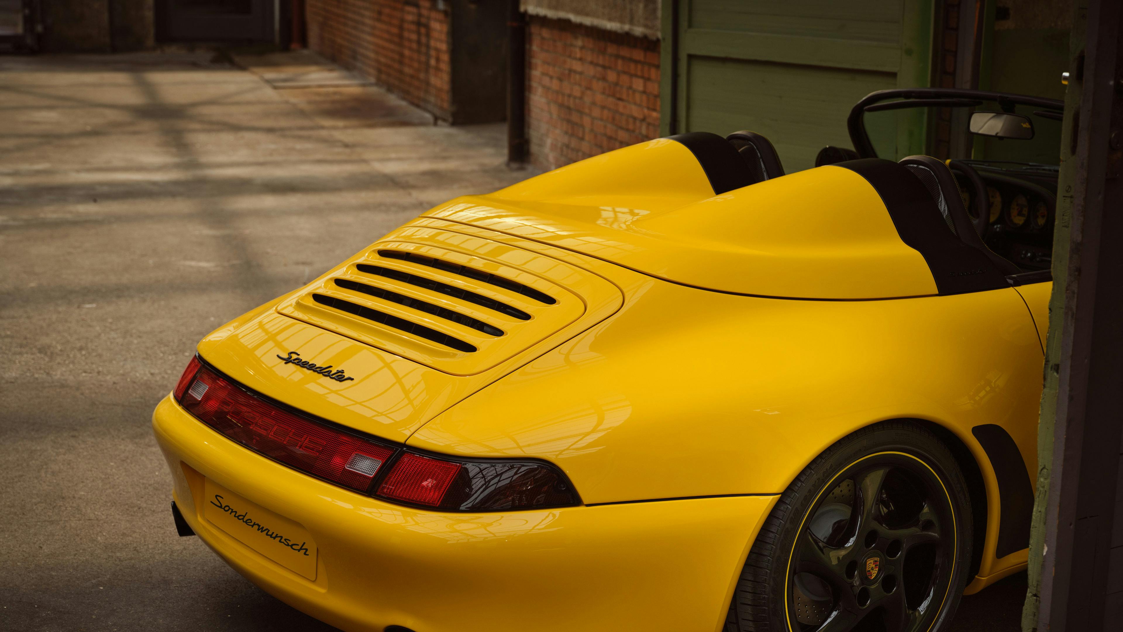Rear view of the Racing Yellow Porsche 911 Speedster.