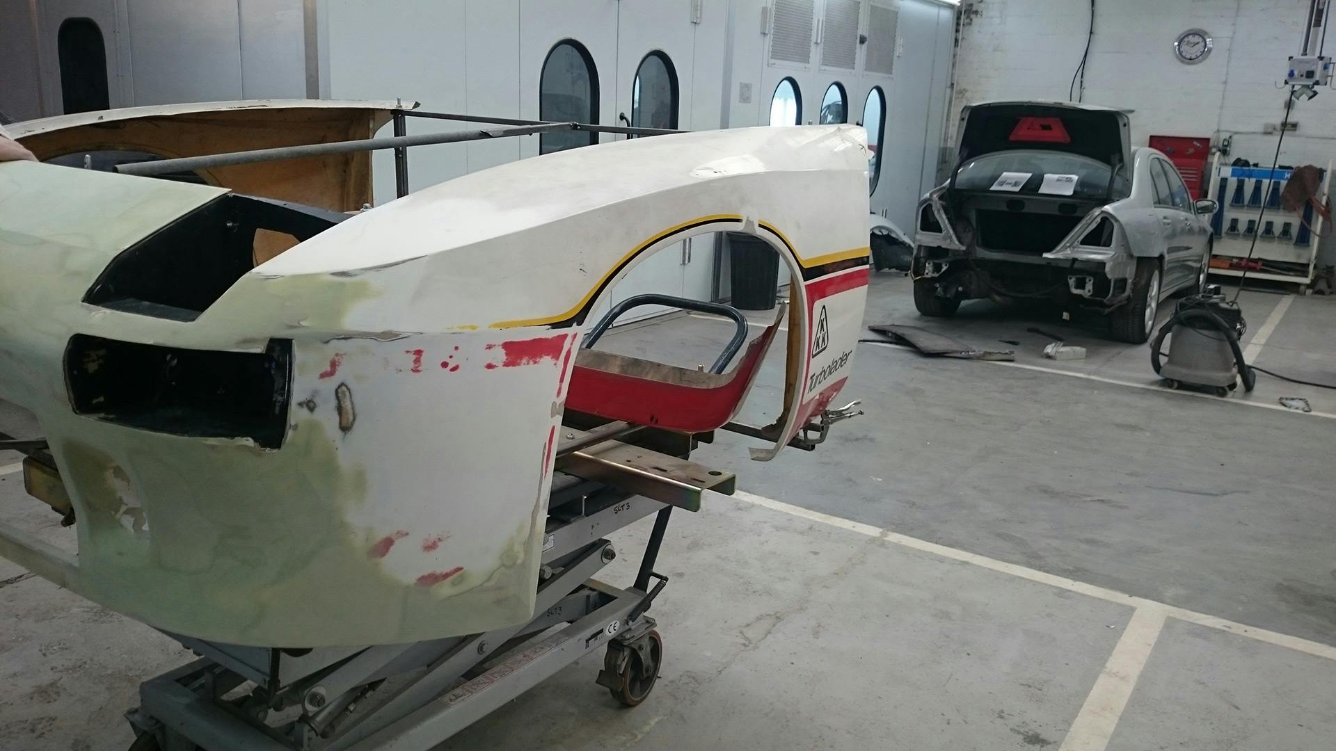 Dismantled front body of the Porsche 924 GTP standing at the workshop.