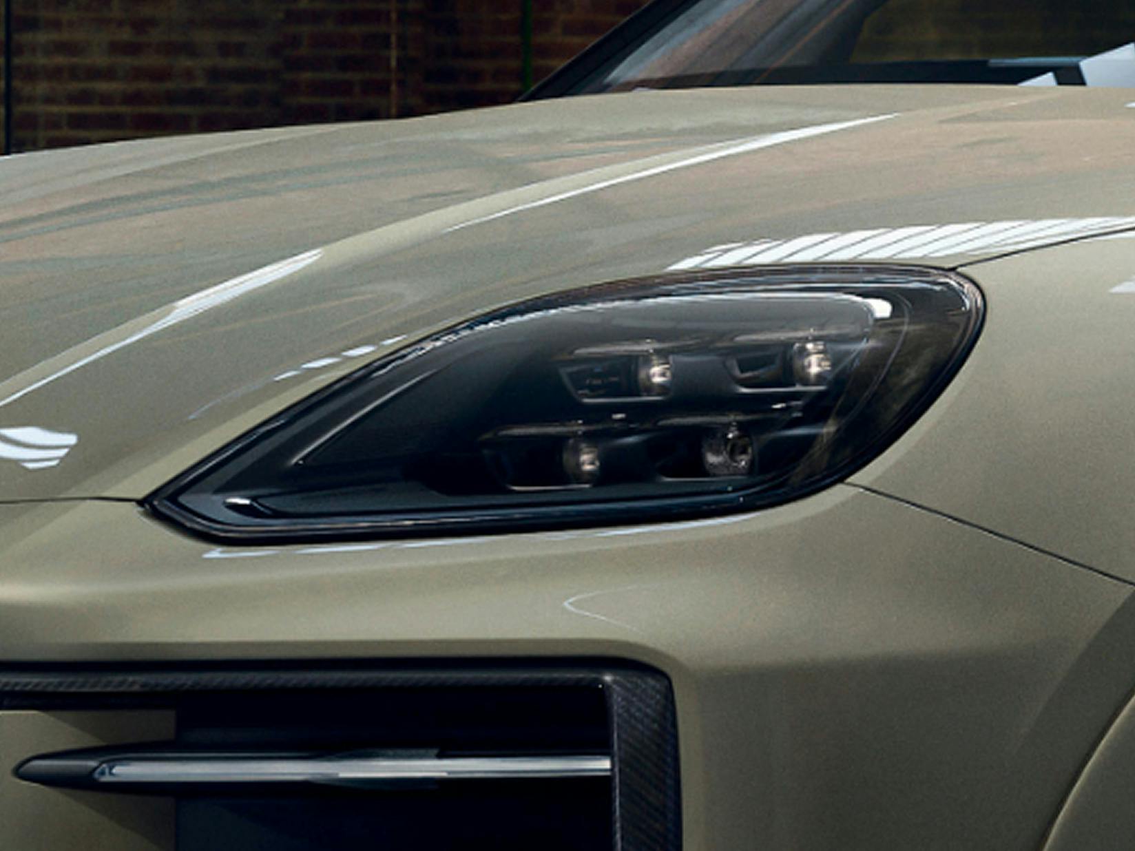 Detailed view of the tinted HD Matrix  LED main headlights on the Porsche Exclusive Manufaktur Cayenne S.