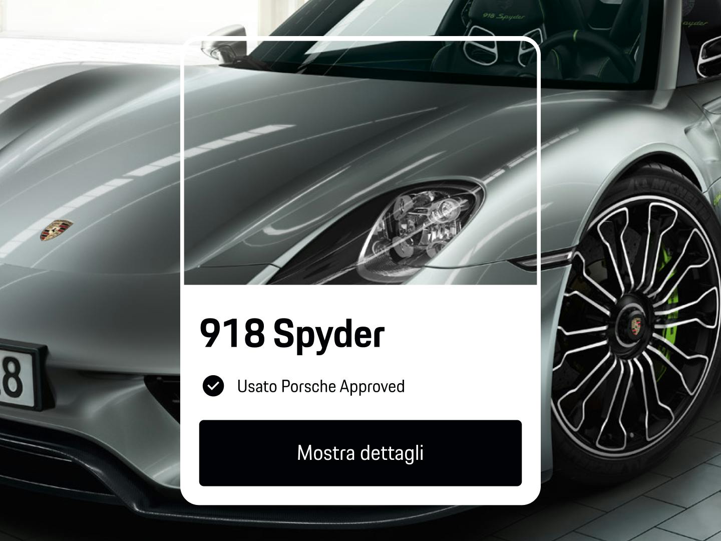 Vista dell'app che mostra una Porsche 918 Spyder argento, usata certificata, con il pulsante nero “Visualizza dettagli” visualizzato sotto.