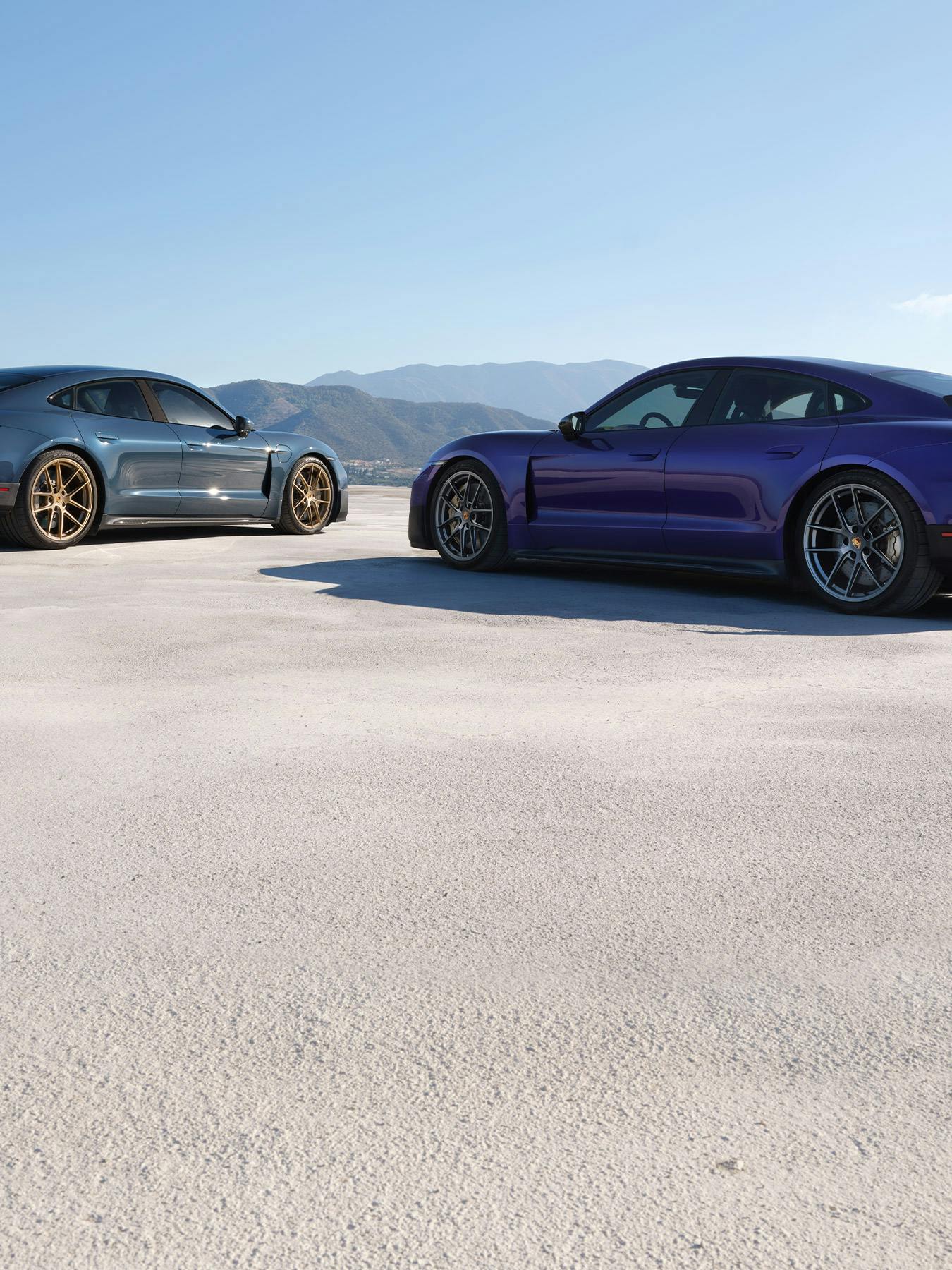 Taycan Turbo and Taycan Turbo GT with Weissach Package in salt plains.