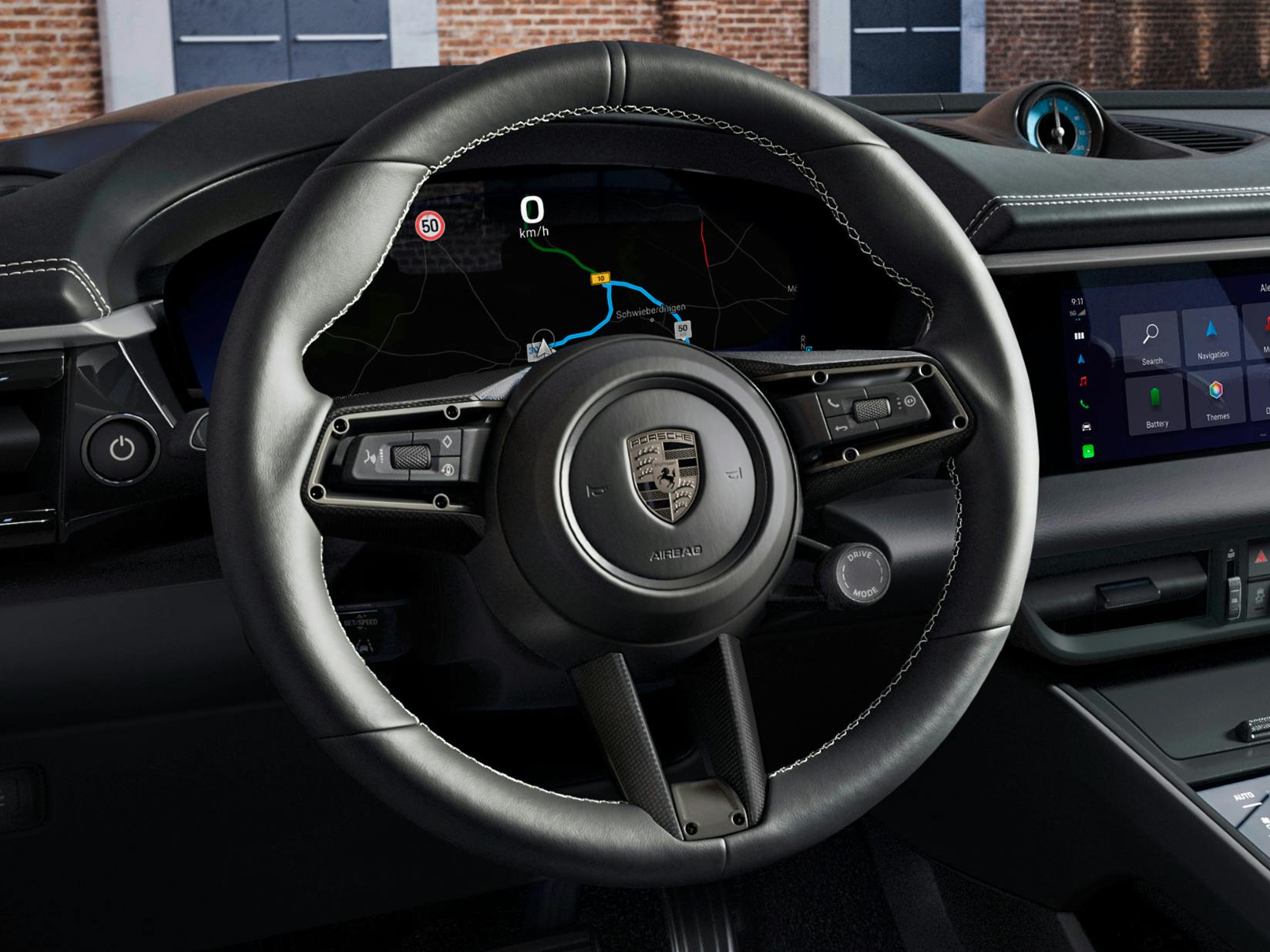 Vue détaillée du volant sport GT multifonction en Race-Tex avec garniture de volant en carbone (finition satinée) dans le Macan Turbo Porsche Exclusive Manufaktur.