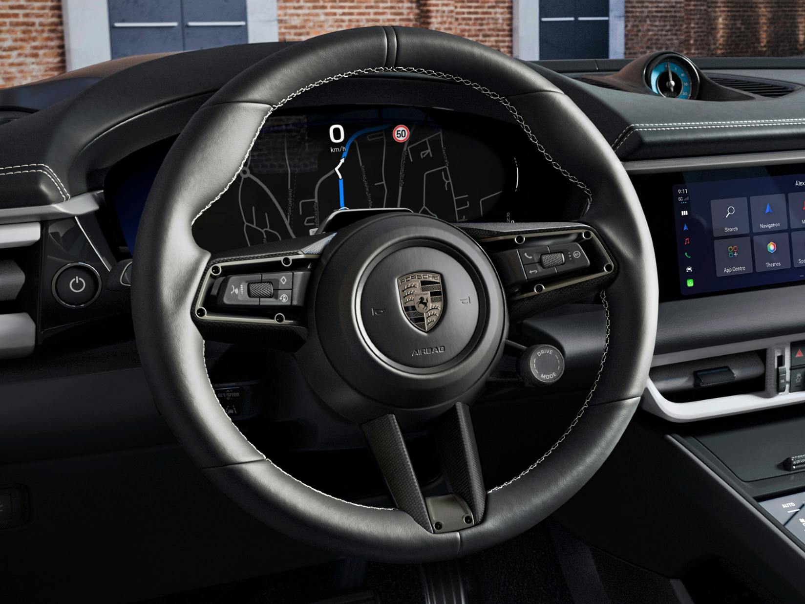 Detailed view of the multifunction GT sport steering wheel in Race-Tex with carbon steering wheel trim in the Porsche Exclusive Manufaktur Macan Turbo.