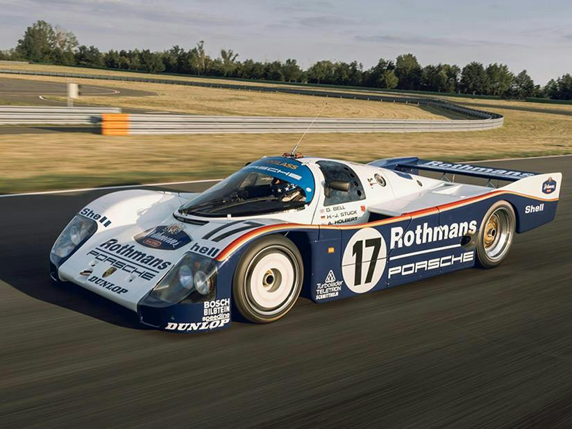 A Rothmans Porsche 962 number 17 racing on track.