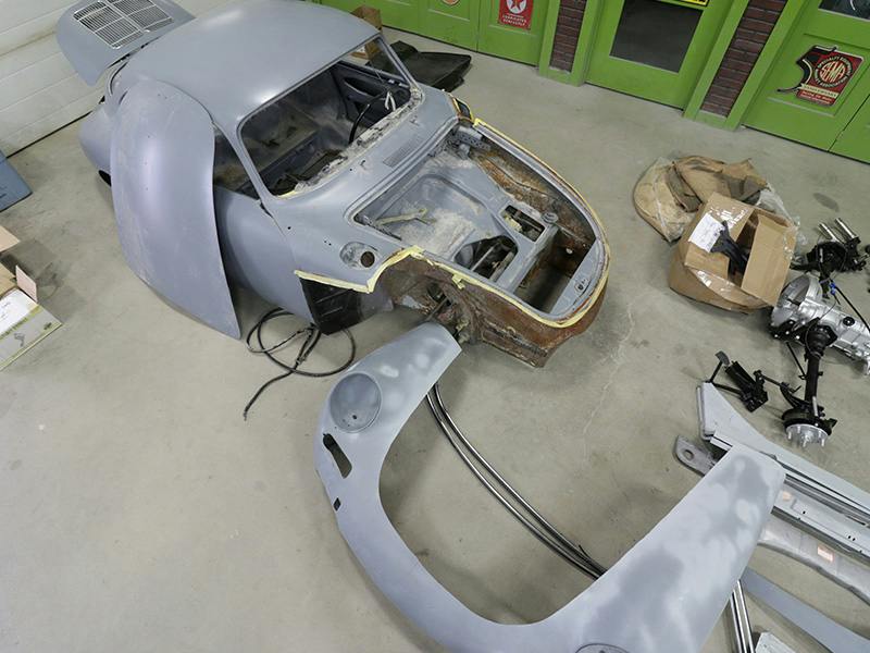 Porsche 356 dismantled into individual parts.