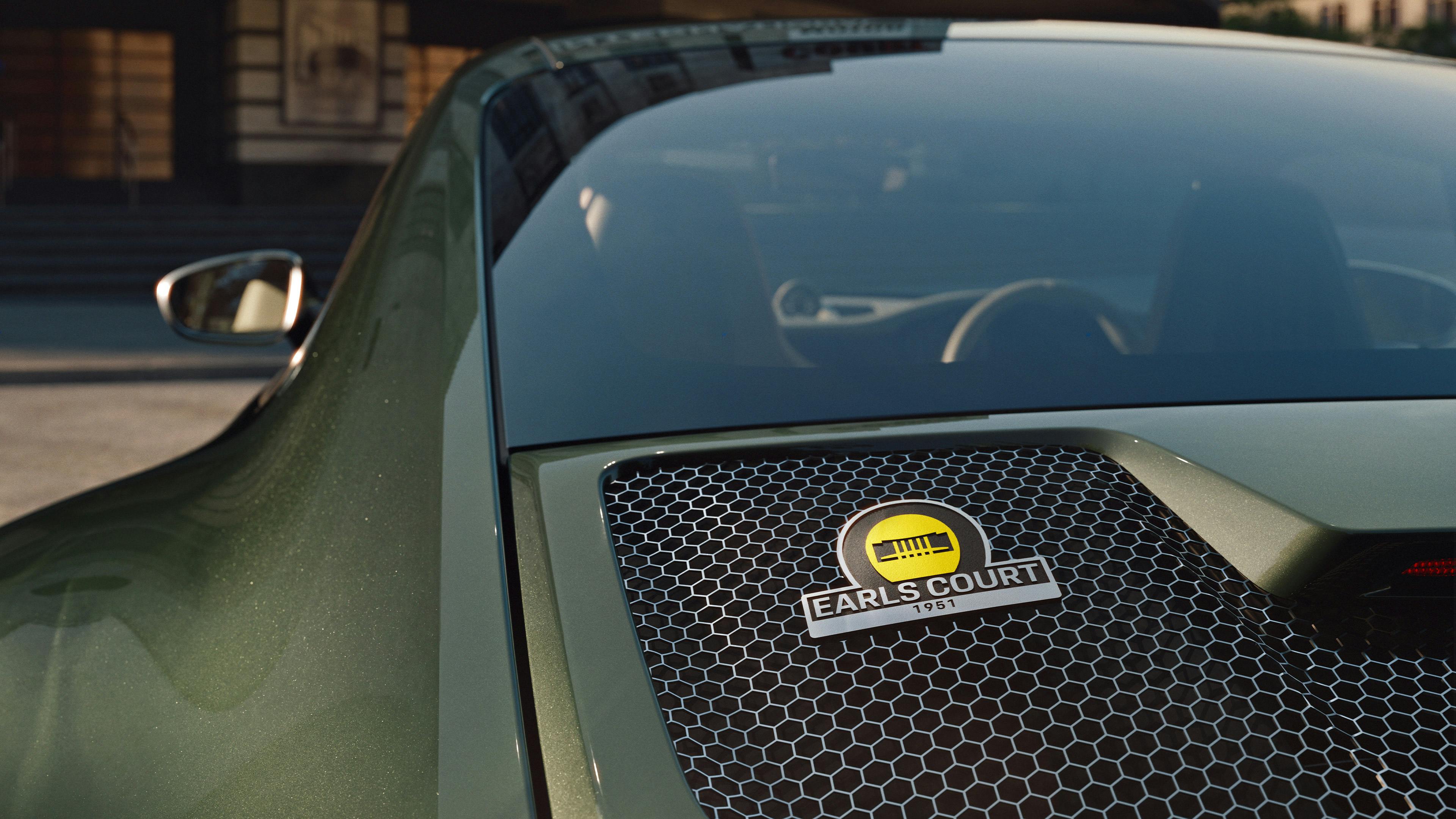 Rear quarter panel detail of the Earls Court 51 Edition, showing the Earls Court badge set into the honeycomb grille.​