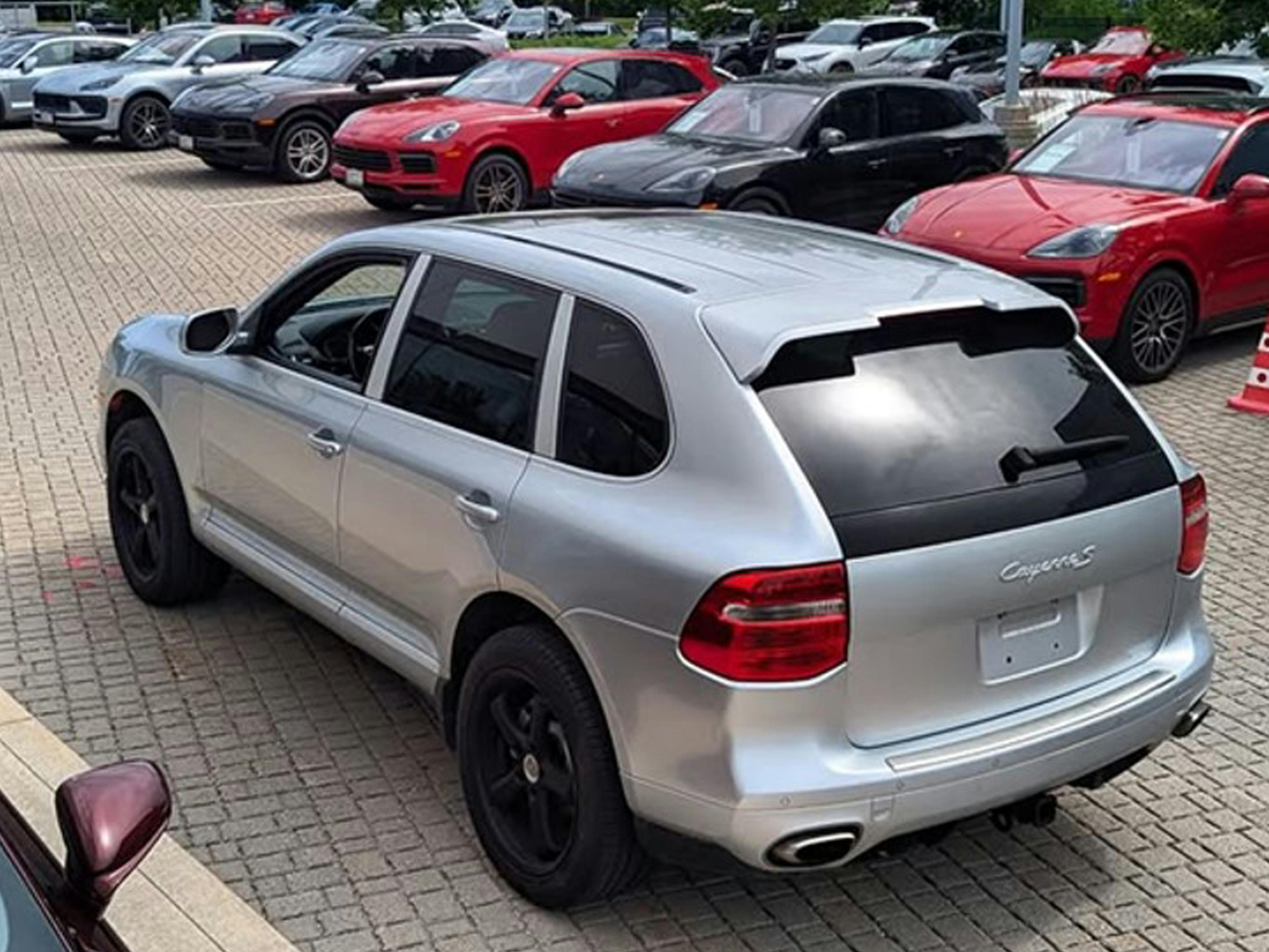 North Toronto – A silver Porsche Cayenne parked on a cobblestone lot.