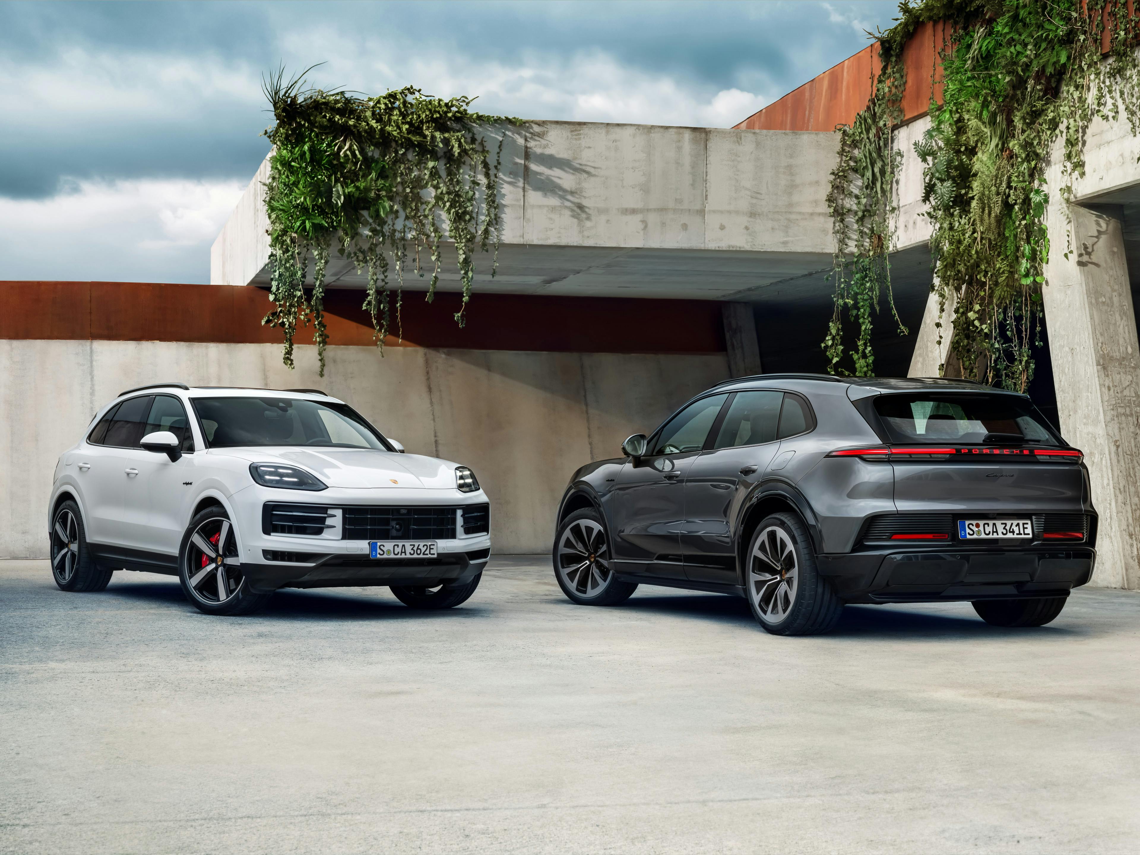 The Cayenne Electric parked next to a Cayenne E-Hybrid.​