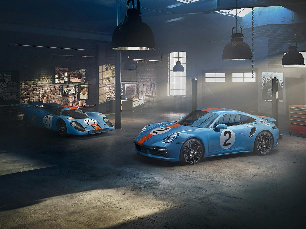 A 911 Turbo S One of a Kind painted in Gulfblue with Gulforange stripes based on the 917 short tail, the racing car driven by Pedro Rodriguez and the 917 short tail next to it.