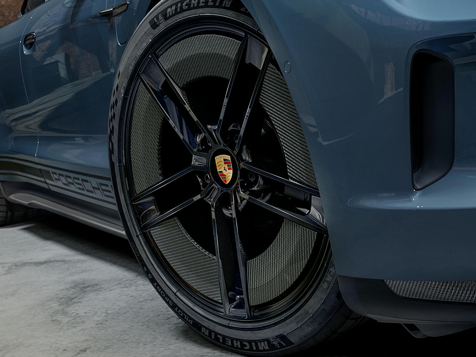 Detailed view of the front wheel of the Porsche Exclusive Manufaktur Taycan GTS.