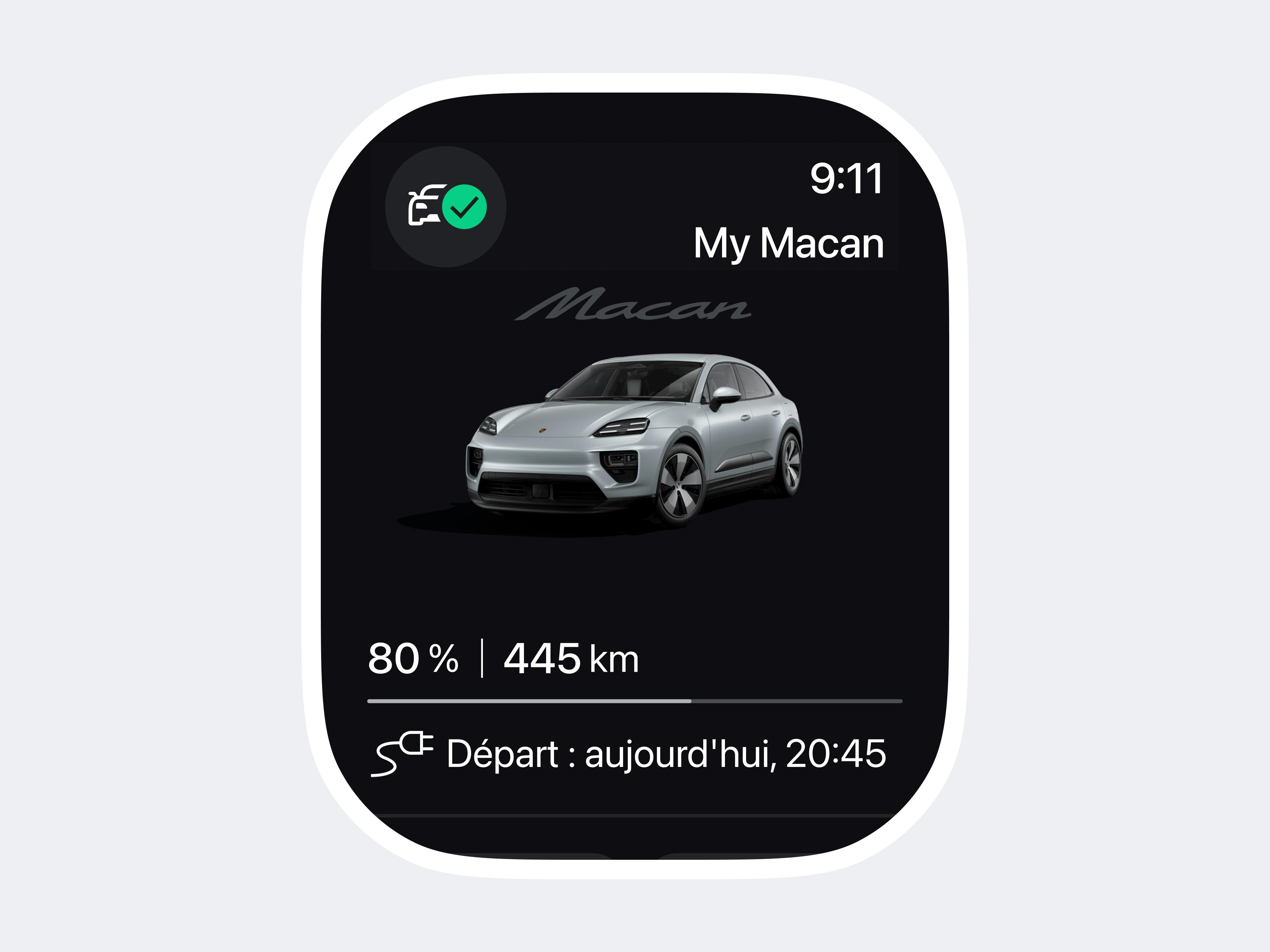 L'écran de la smartwatch affiche une Porsche Macan argentée avec des informations sur le niveau de charge et l'heure de départ sur une application sombre.