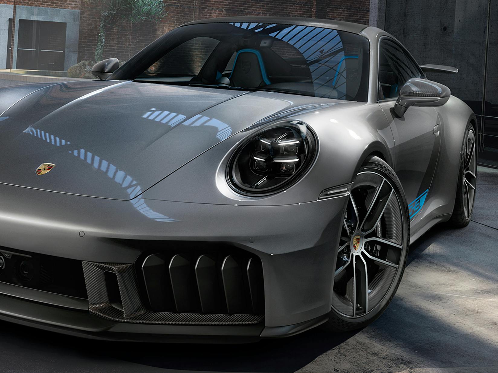 Porsche Exclusive Manufaktur 911 Carrera GTS in a warehouse. Front view.