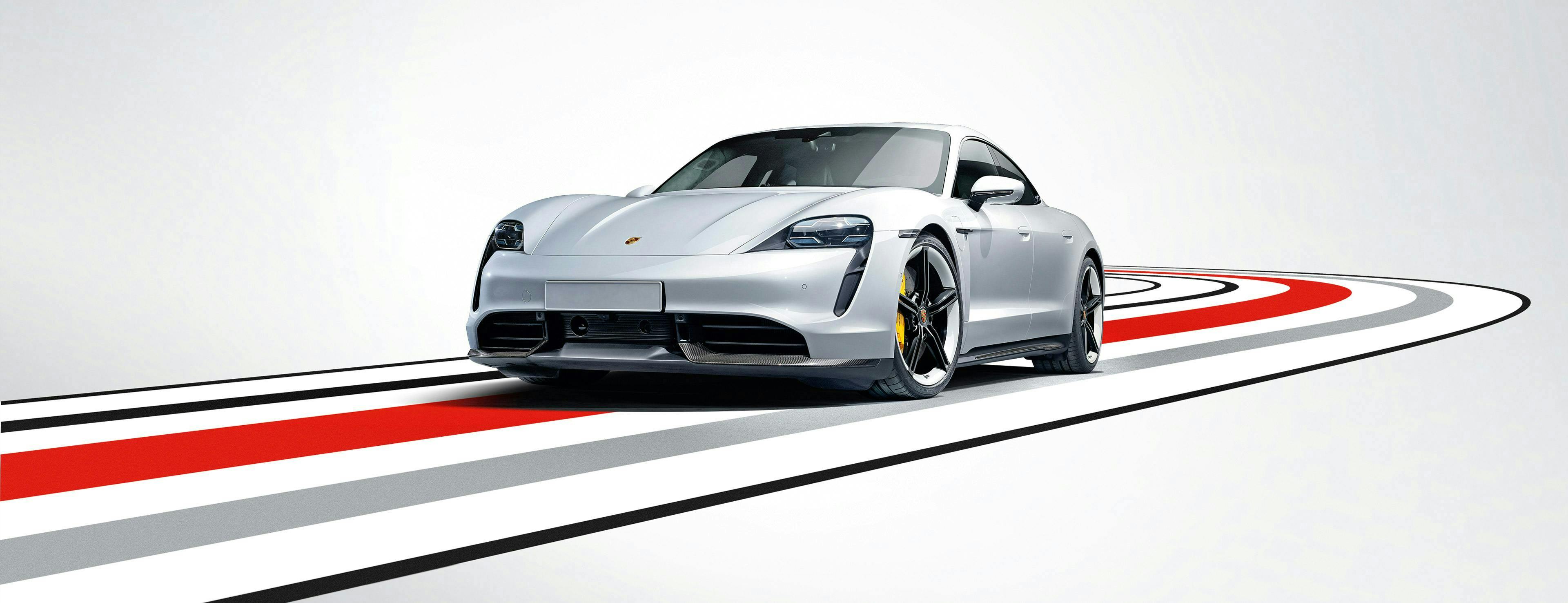 Système de lancement d’alerte de Porsche : une Porsche Taycan Turbo S négocie un virage.