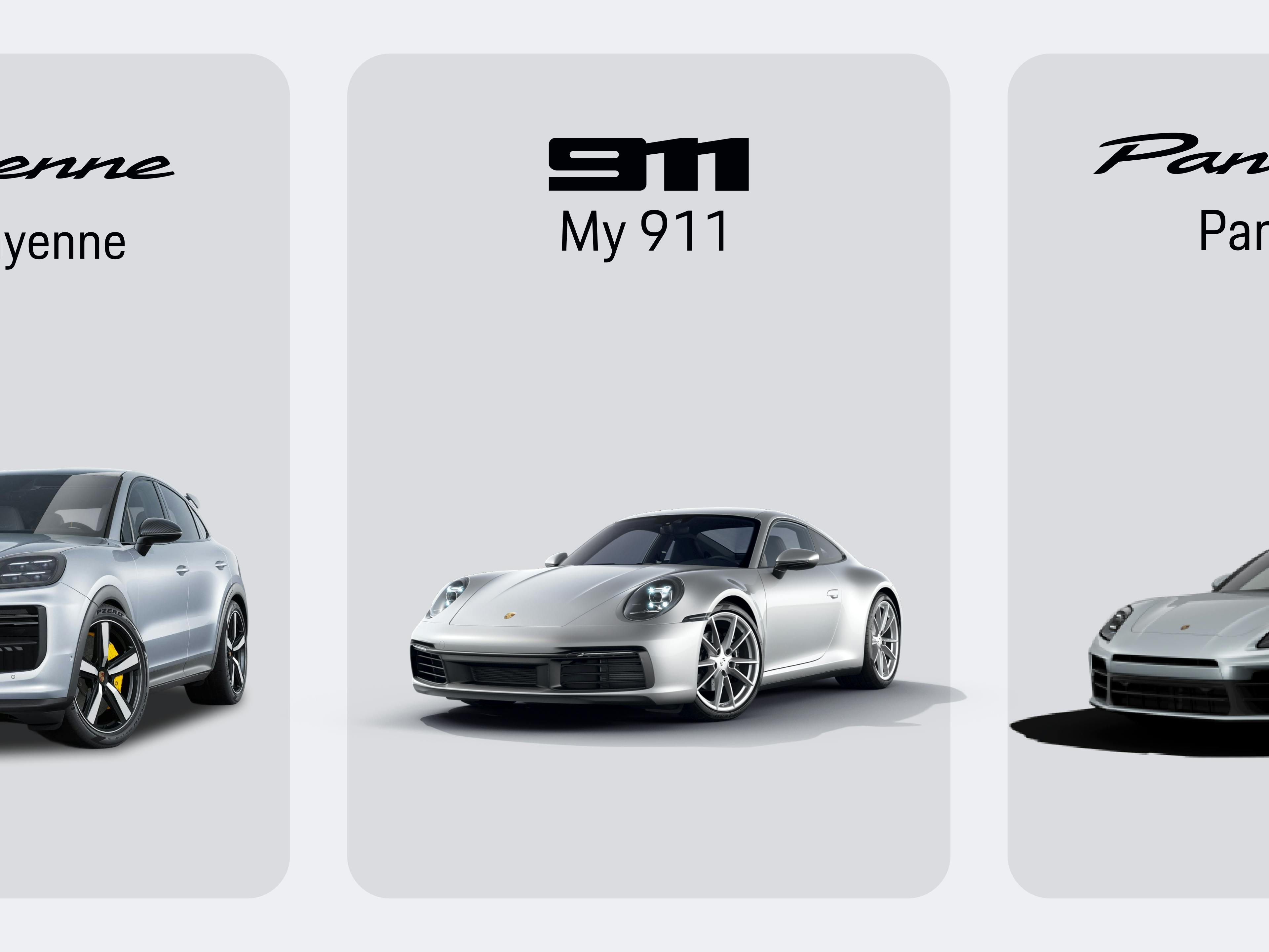 Vista de la aplicación que muestra tres modelos de Porsche: el SUV Cayenne a la izquierda, el deportivo 911 en el centro y el Panamera a la derecha.
