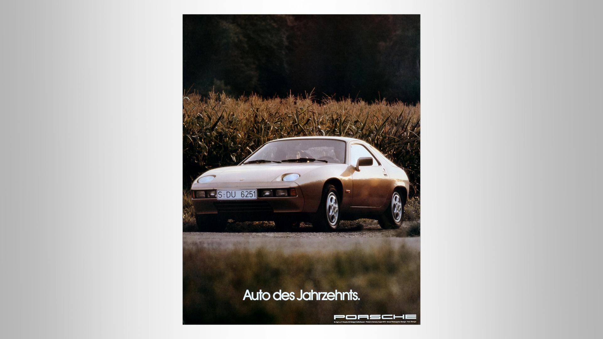 Advertising poster with a historic porsche standing on a field path with the writing: Car of the decade.