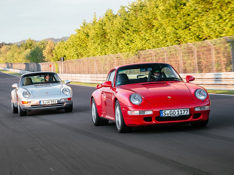 Two Porsche 993s driving, overtaking manoeuvre.