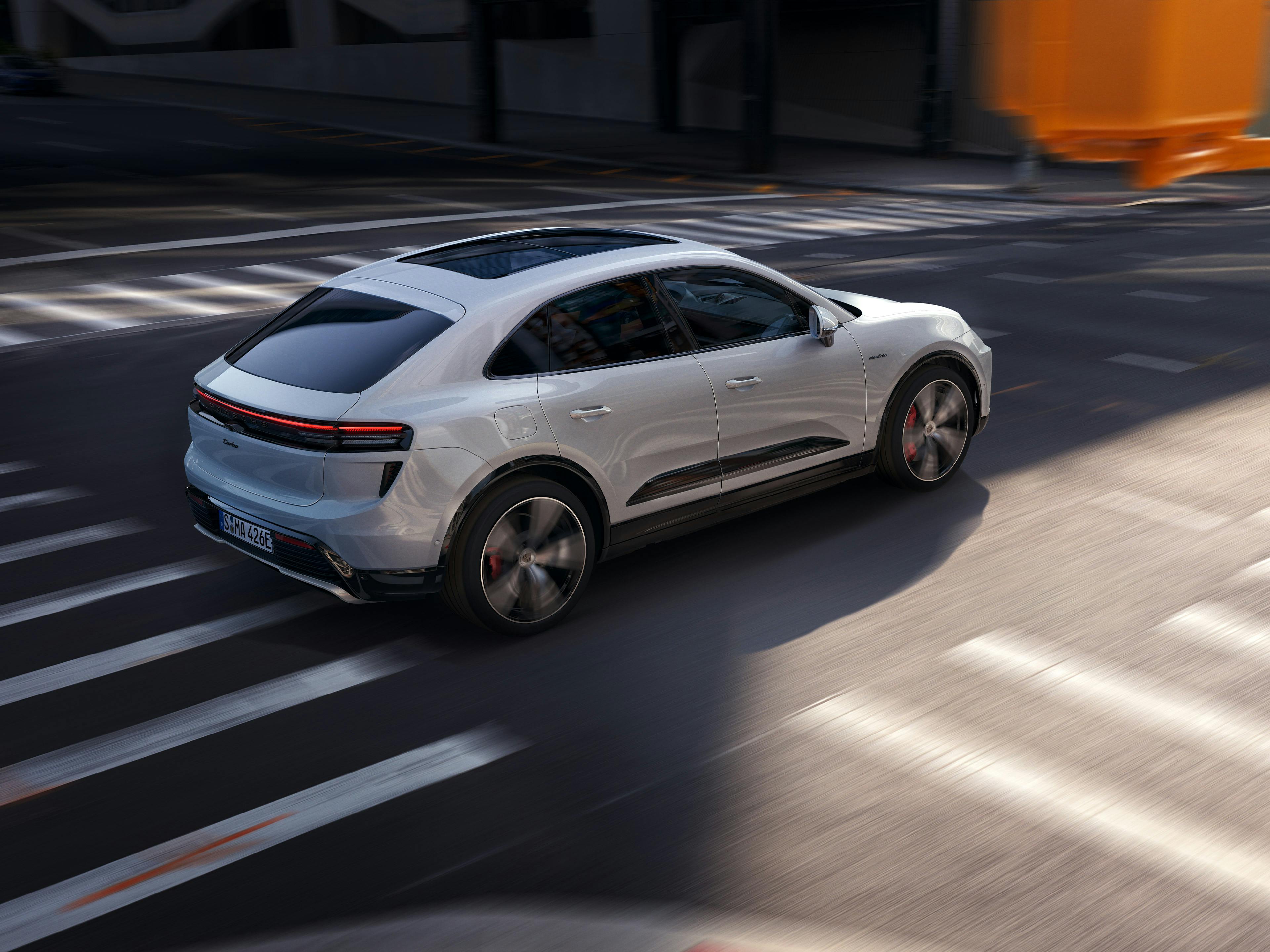 The Macan Turbo driving along a city street.