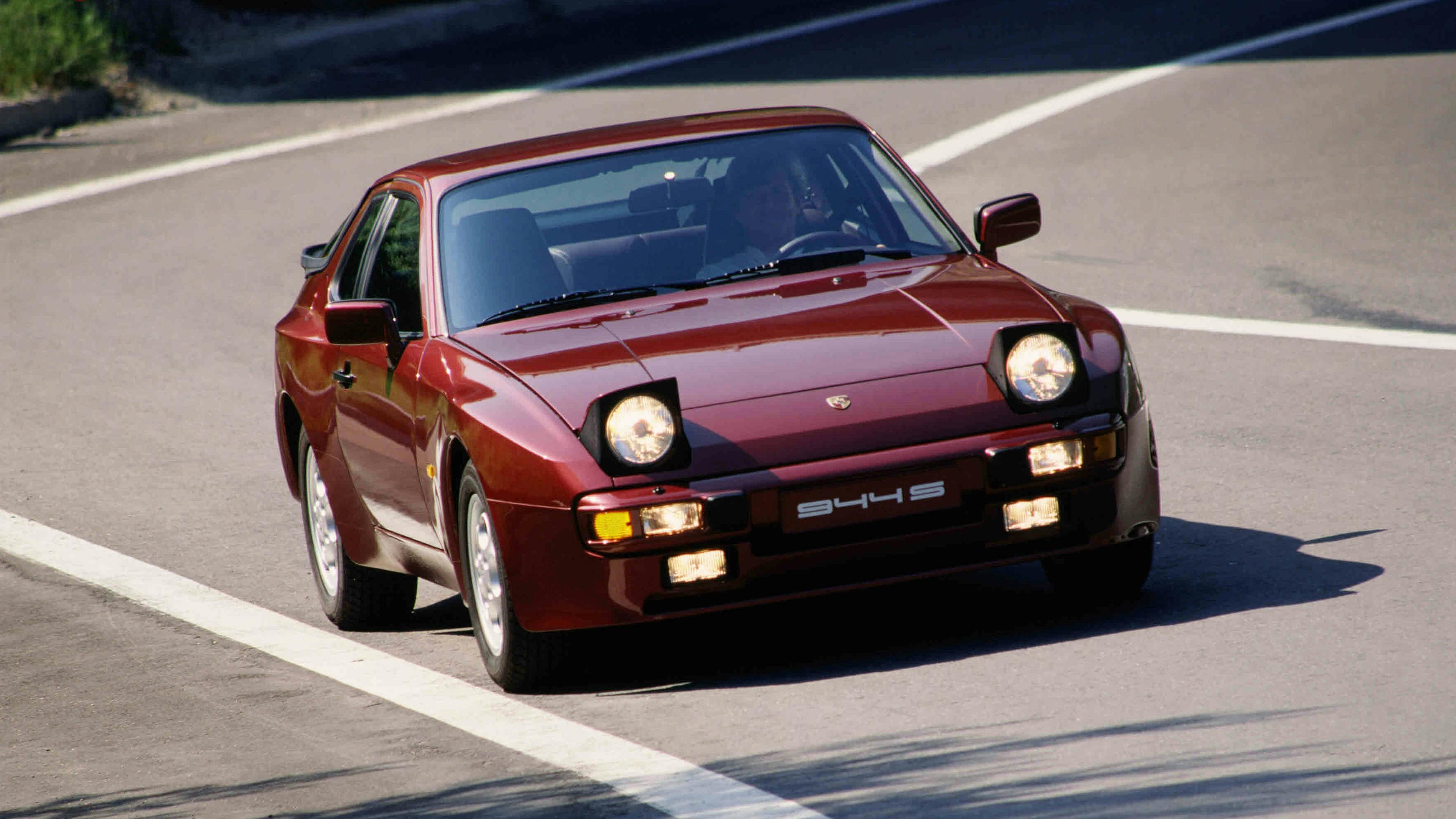 Red Porsche 944 S (1978–88) with pop-up headlights