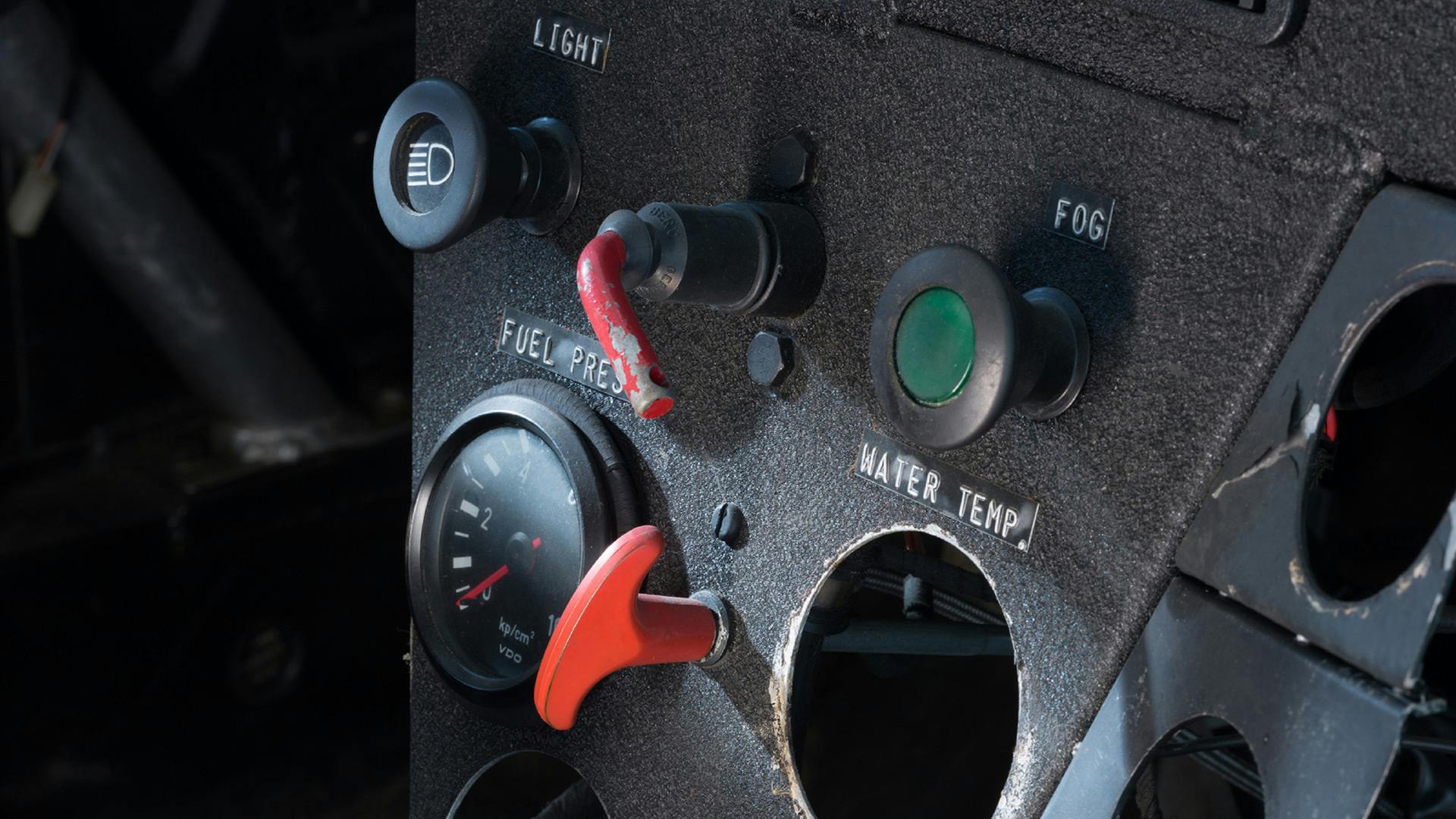 Instruments and buttons in the interior of the Porsche 924 GTP before restoration.