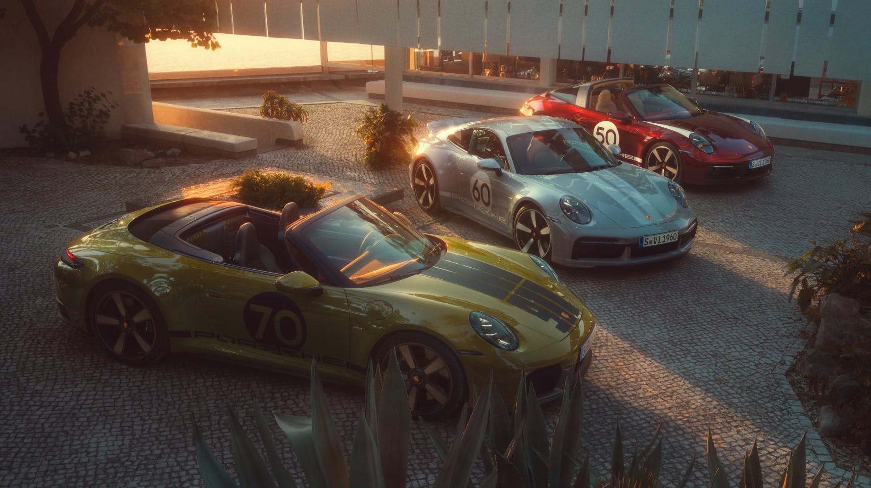 3 Porsche 911s with Heritage Design Packages next to each other.