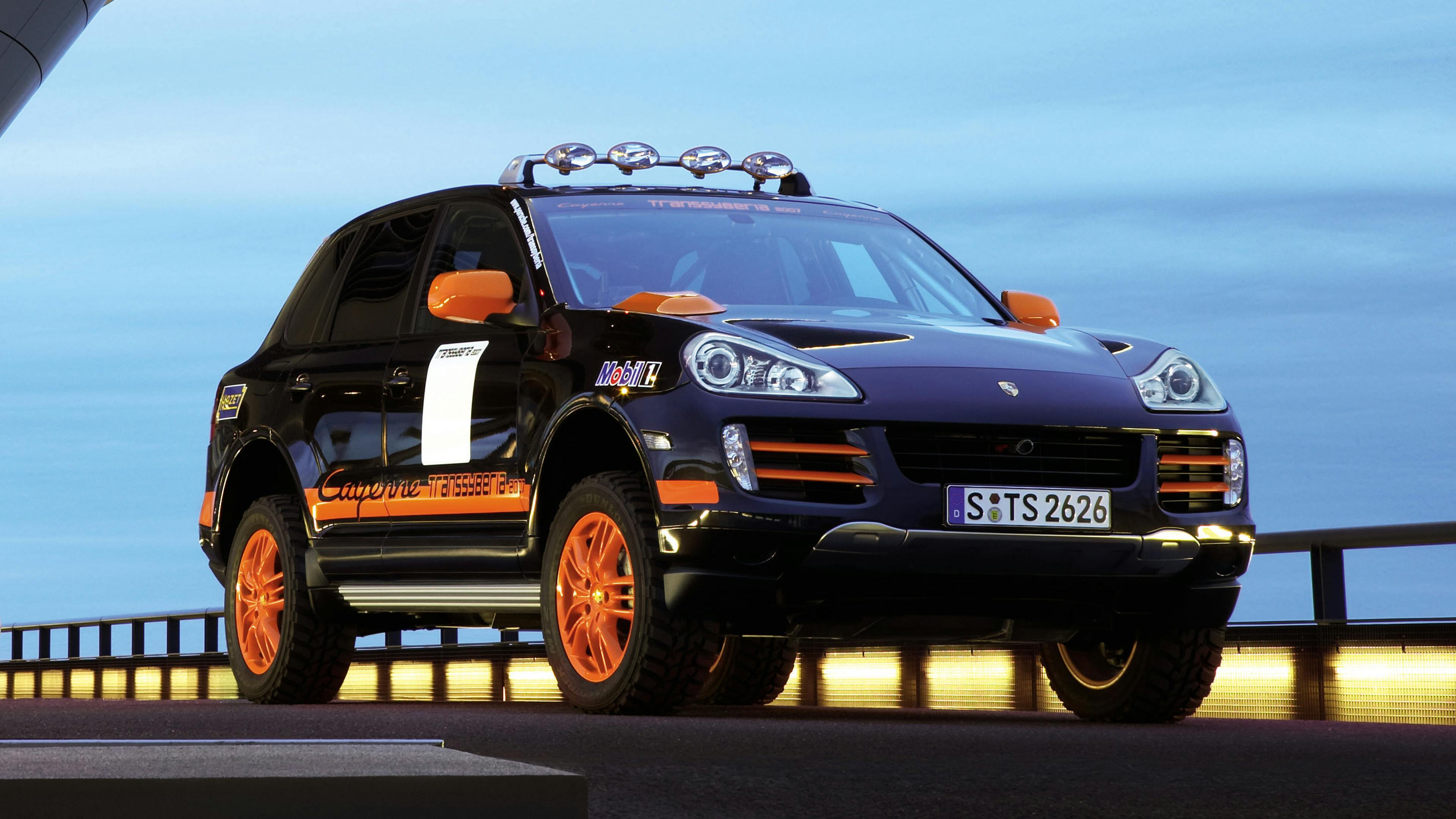 Black Porsche Cayenne Transsyberia with orange rims