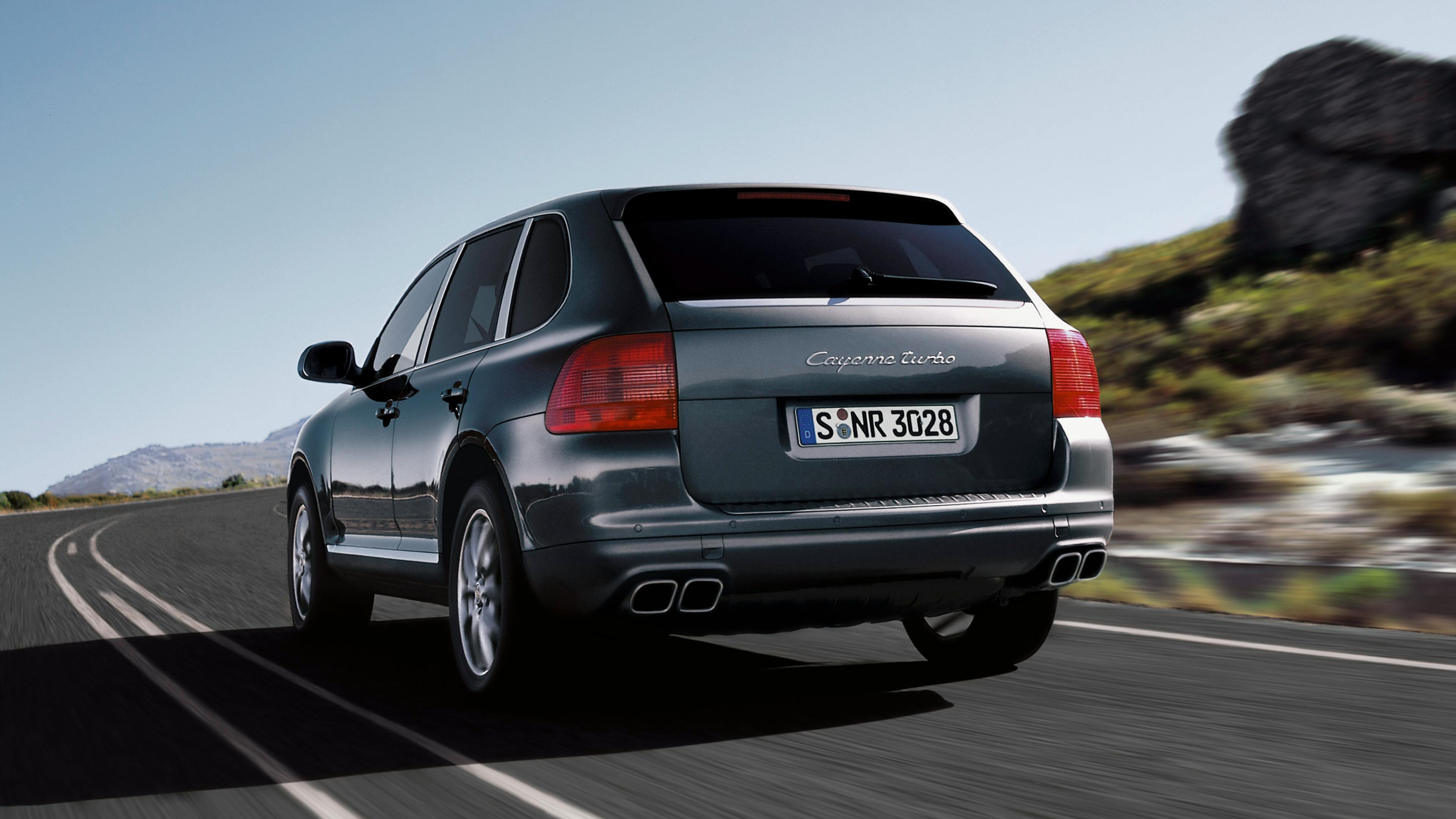 Porsche Cayenne Turbo in dark grey on the street