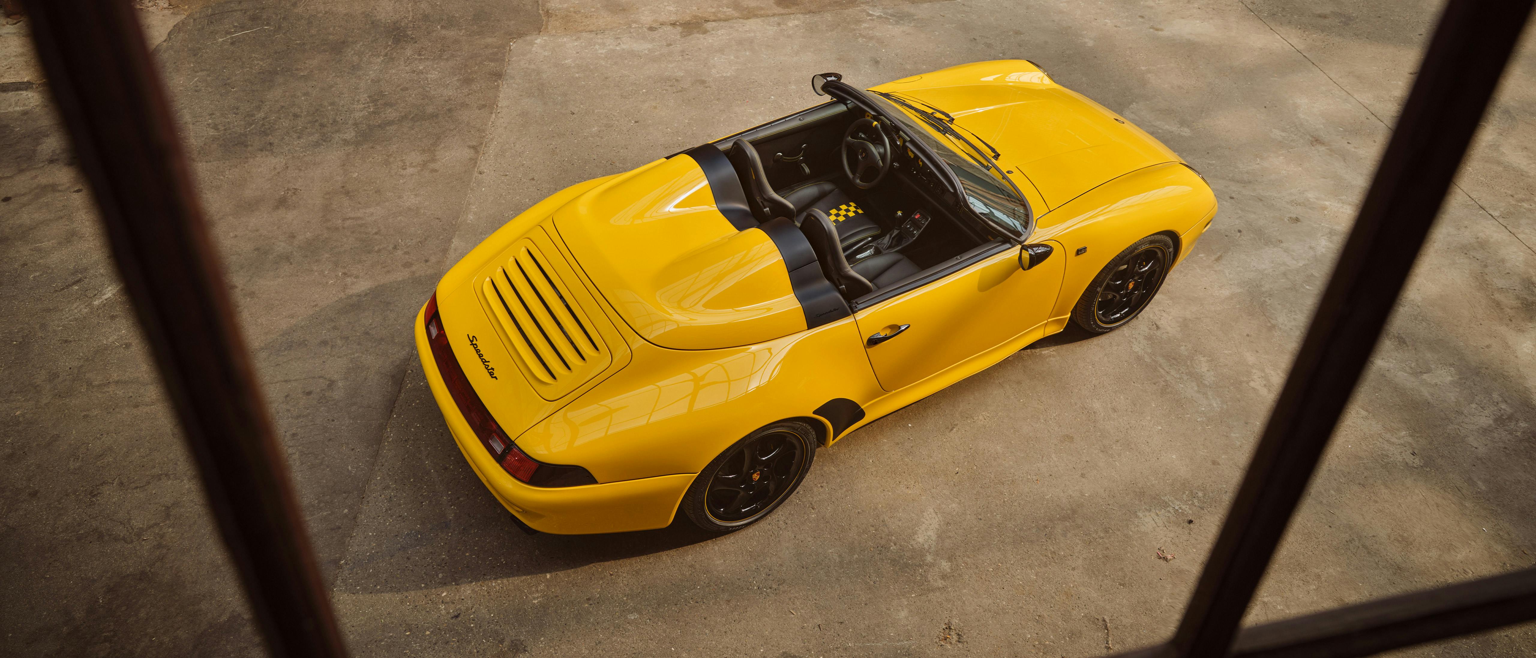 993 Speedster with open top, photographed from above on a light concrete floor.
