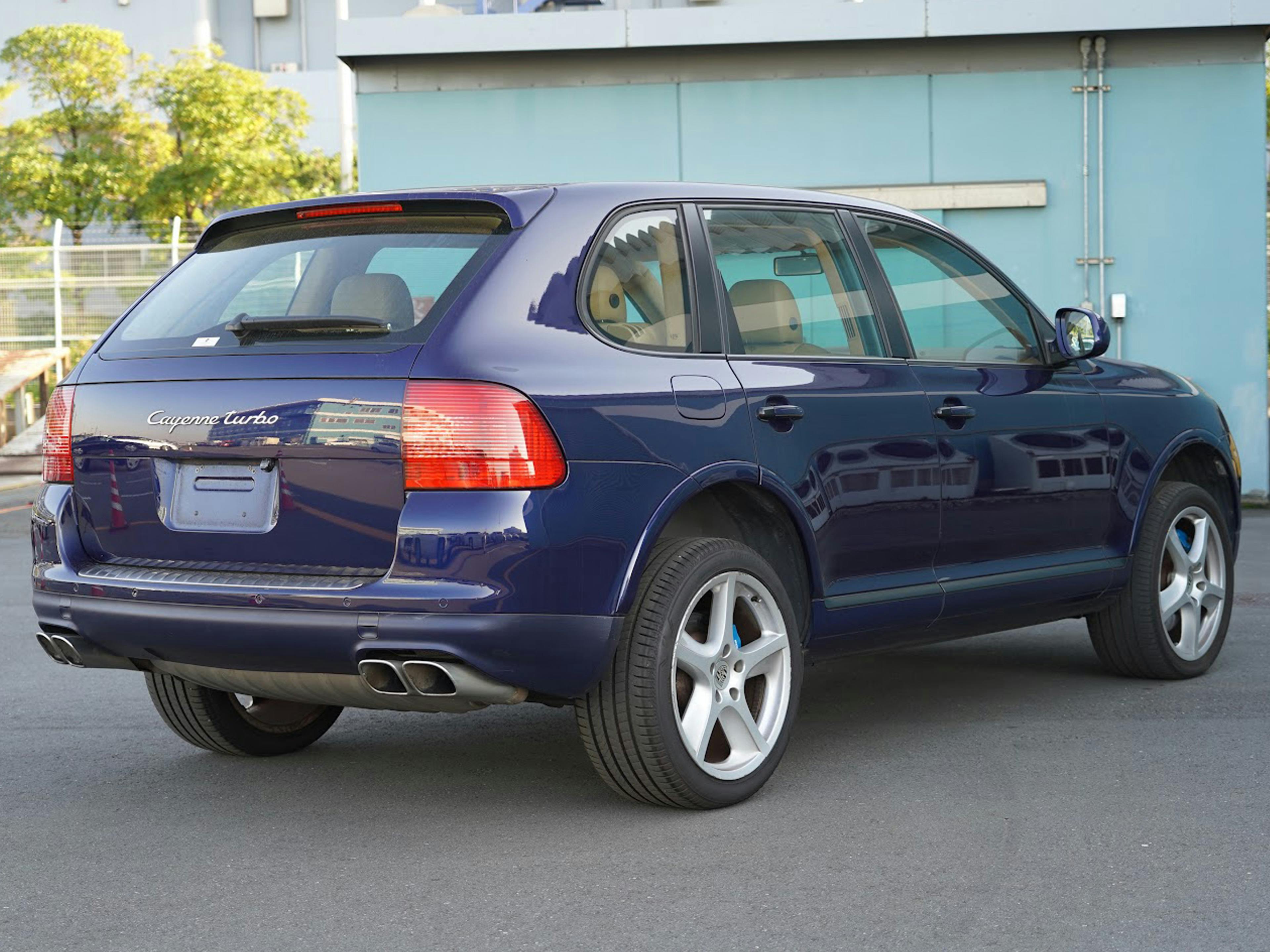Vaughan – A blue Porsche Cayenne parked outdoors, viewed from the rear.