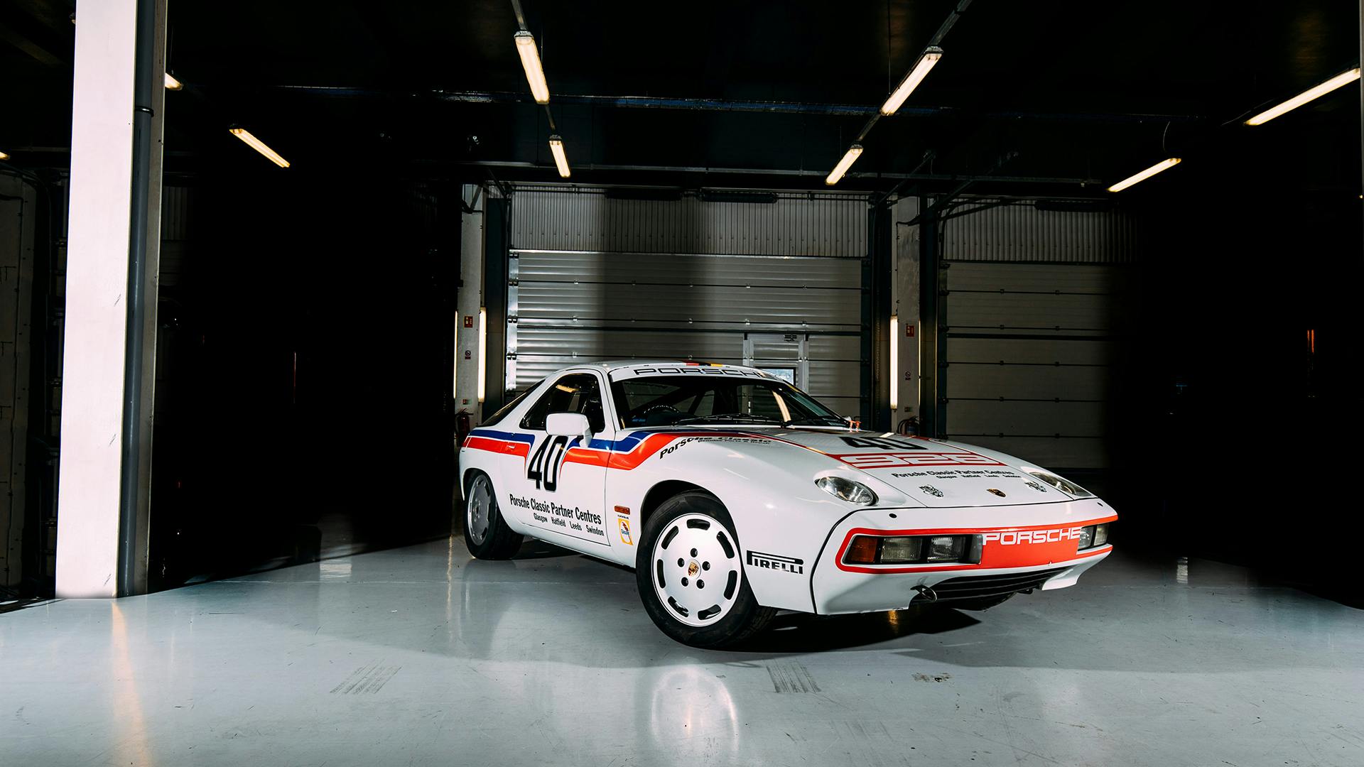 The Porsche 928 standing in a hall showing its front.