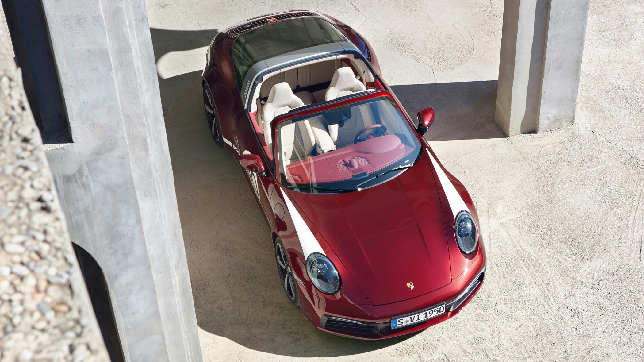 Porsche 911 Targa 4S Heritage Design Edition in Cherry Metallic in front of arches. Side view.
