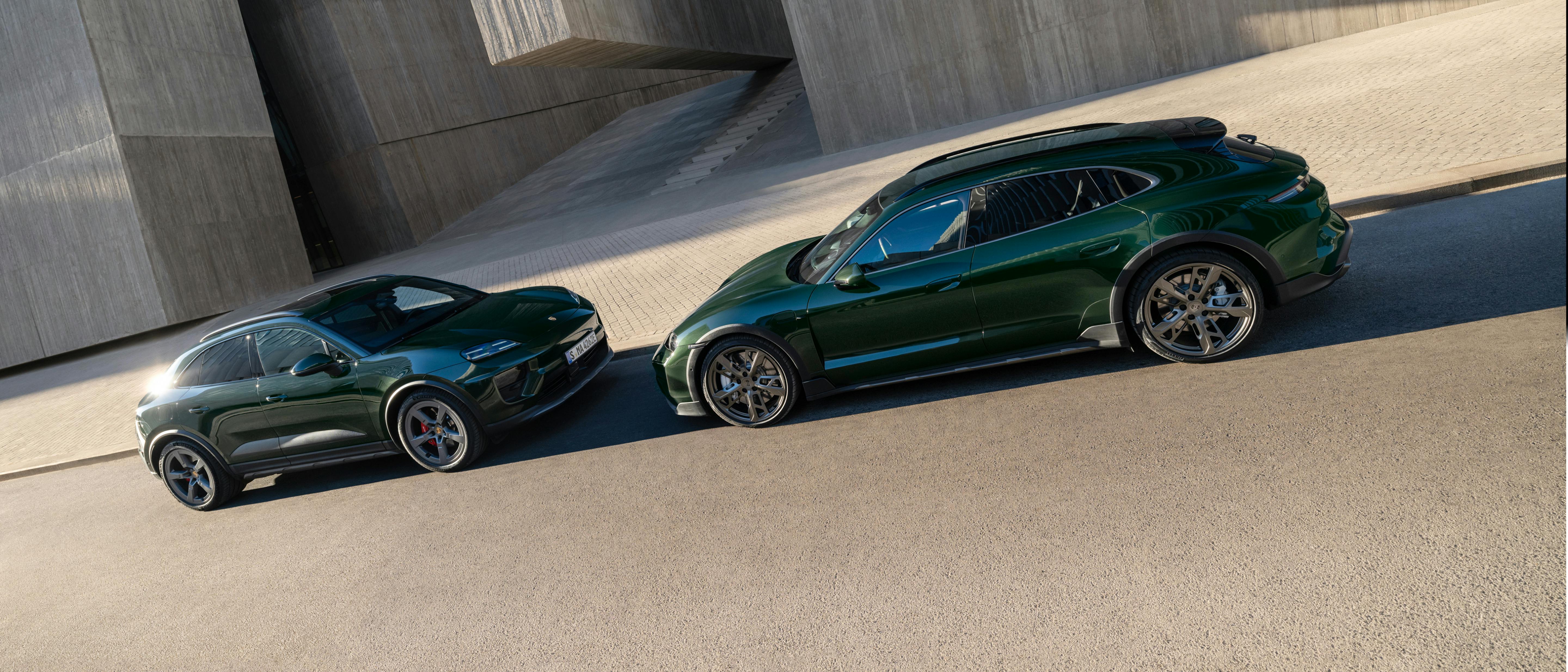 A Porsche Macan 4S and a Porsche Taycan Turbo Cross Turismo facing each other.