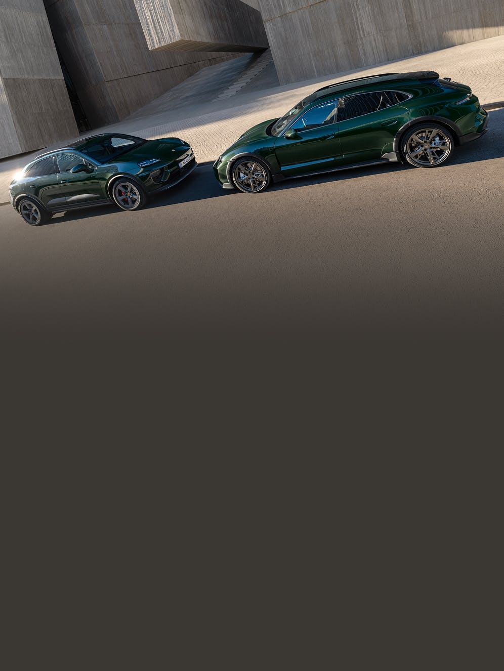 A Porsche Macan 4S and a Porsche Taycan Turbo Cross Turismo facing each other.