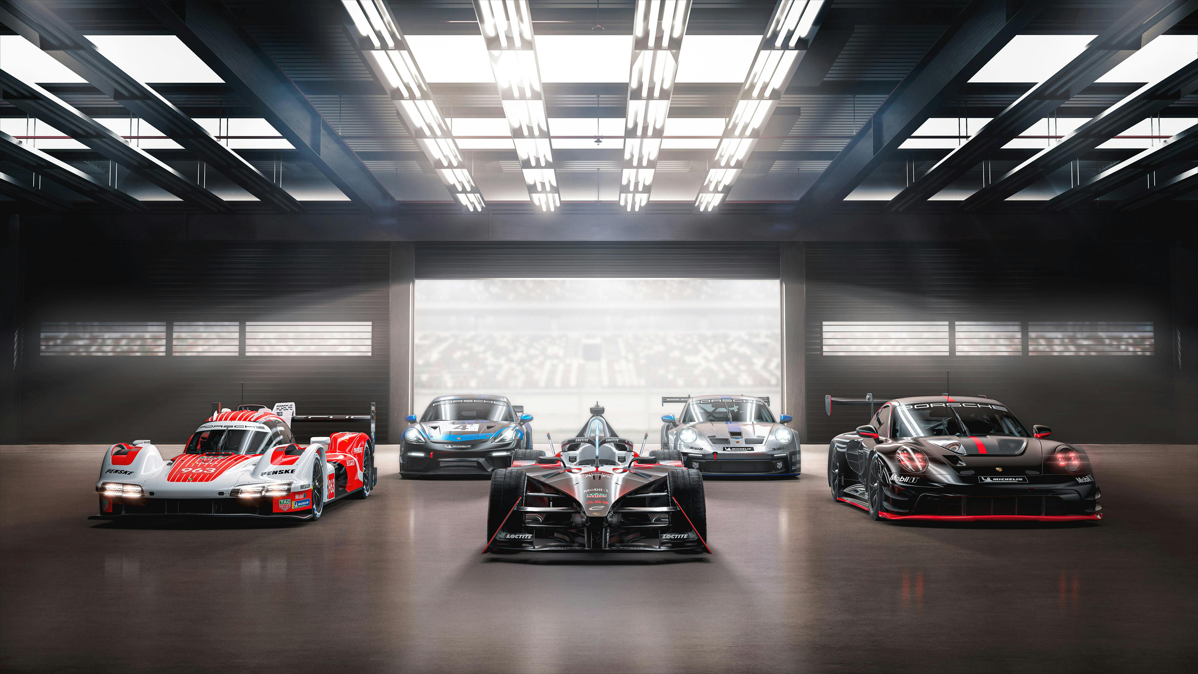 Porsche Motorsport Range Visual with 5 models of 2023/2024 lined up frontally in a hall.