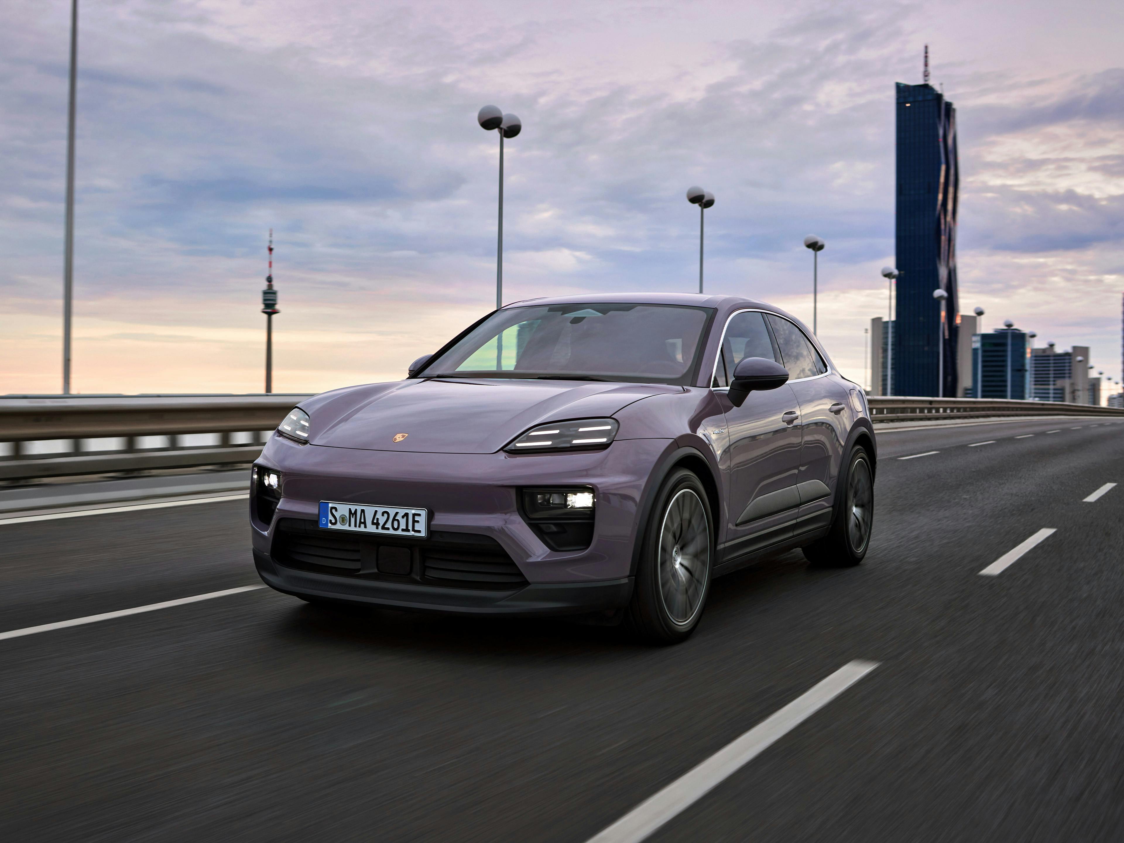 Provence Porsche Macan driving on a highway.