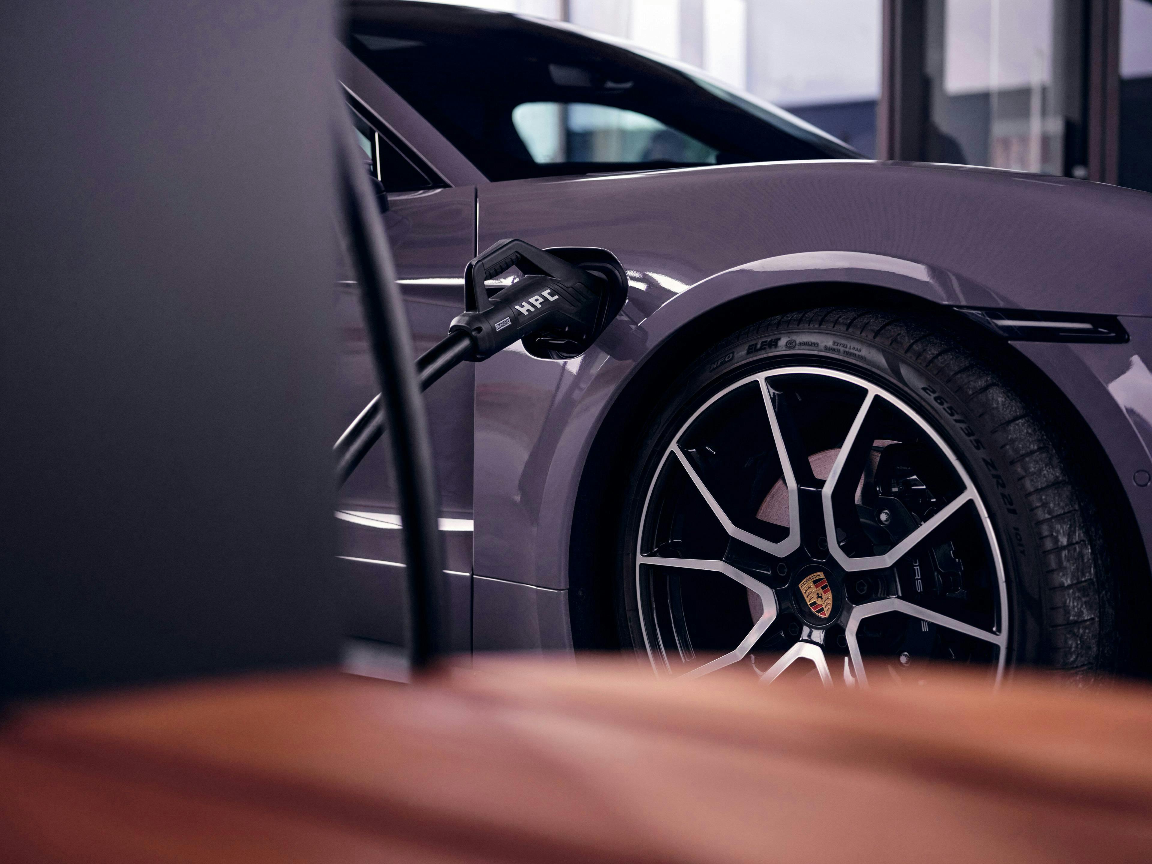 Taycan being charged by Porsche Charger