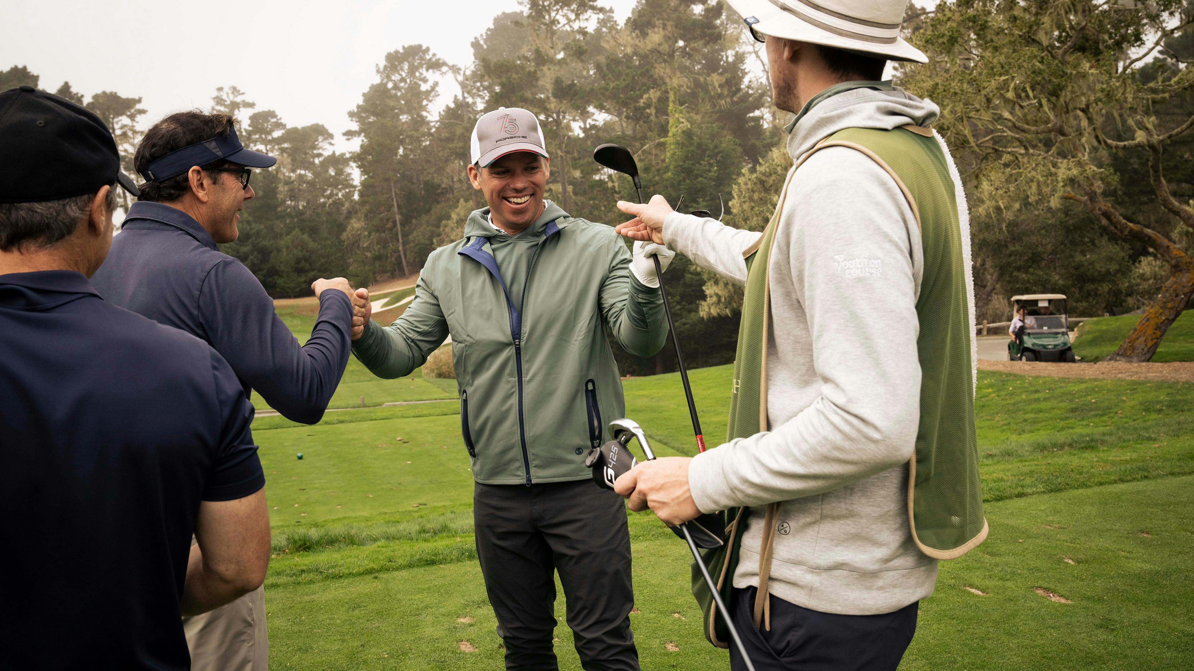 Golfers laughing.