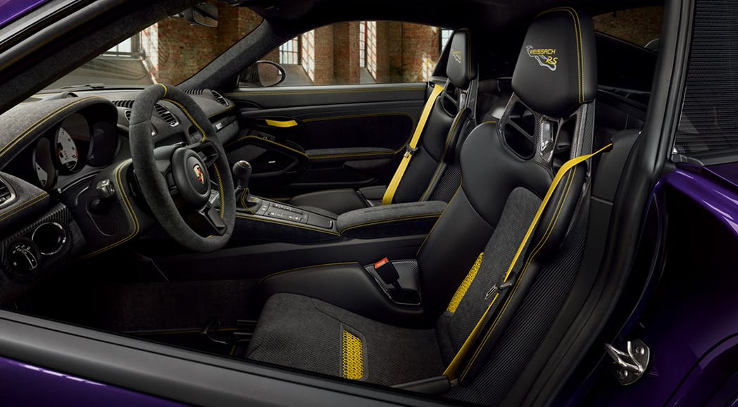 View into the cockpit of the Porsche 718 Cayman GT4 RS.